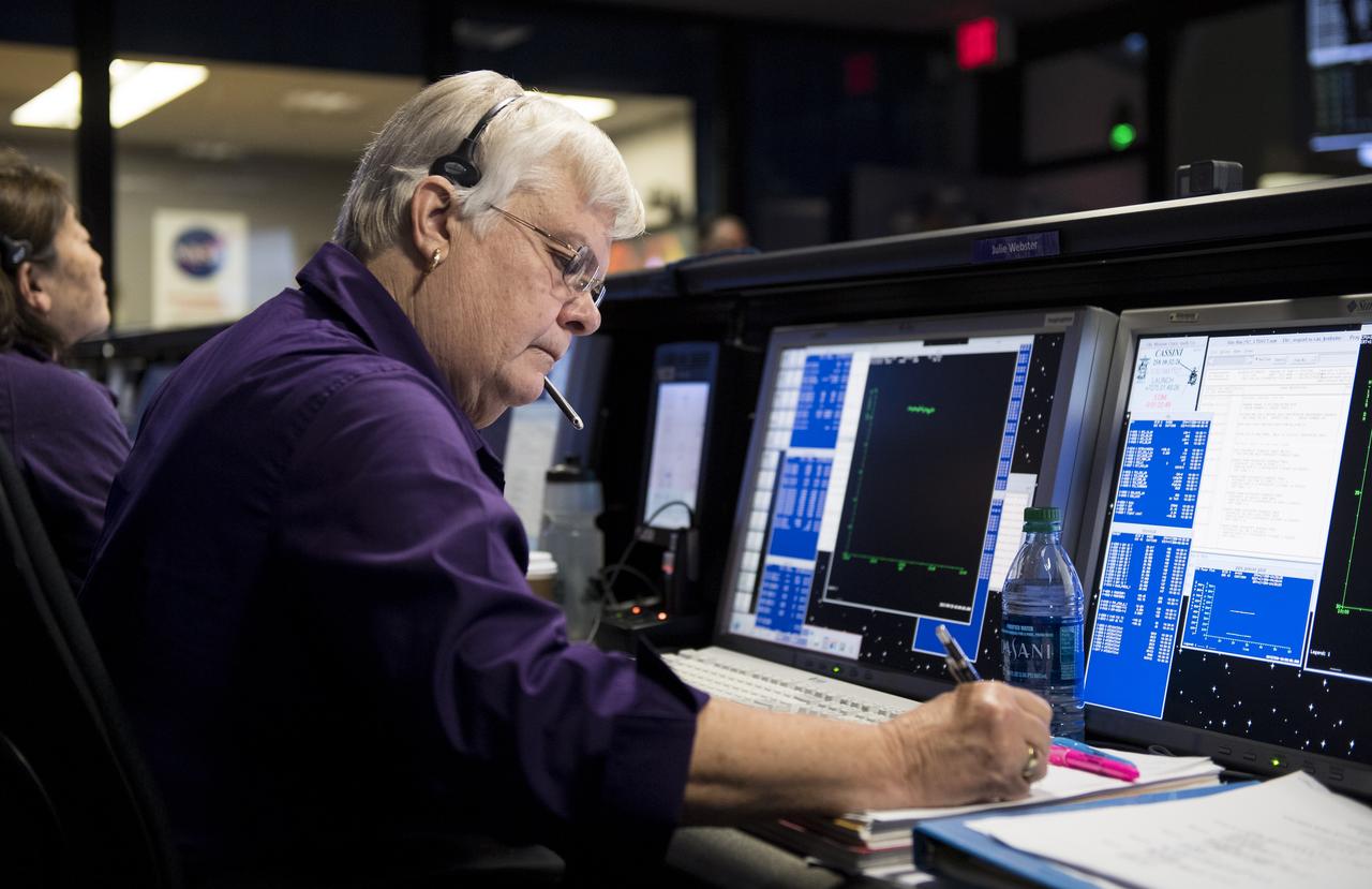Spacecraft operations team manager for the Cassini mission at Saturn, Julie Webster is seen in mission control as the Cassini spacecraft makes its final plunge into Saturn, Friday, Sept. 15, 2017 at NASA's Jet Propulsion Laboratory in Pasadena, California. Since its arrival in 2004, the Cassini-Huygens mission has been a discovery machine, revolutionizing our knowledge of the Saturn system and captivating us with data and images never before obtained with such detail and clarity. On Sept. 15, 2017, operators deliberately plunged the spacecraft into Saturn, as Cassini gathered science until the end. Loss of contact with the Cassini spacecraft occurred at 7:55 a.m. EDT (4:55 a.m. PDT). The “plunge” ensures Saturn’s moons will remain pristine for future exploration. During Cassini’s final days, mission team members from all around the world gathered at NASA’s Jet Propulsion Laboratory, Pasadena, California, to celebrate the achievements of this historic mission. Photo Credit: (NASA/Joel Kowsky)