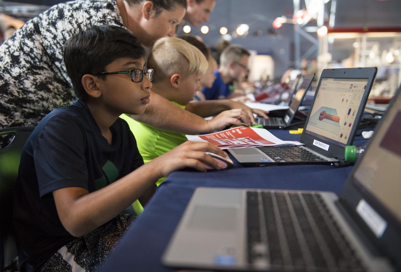 A participant creates digital 3D models using Autodesk Tinkercad in the Two for the Crew Challenge at a pop-up makerspace held by Future Engineers, with support from NASA and The American Society of Mechanical Engineers (ASME), at the Steven F. Udvar-Hazy Center, Thursday, September 21, 2017 in Chantilly, Virginia. Participants had the opportunity to create digital 3D models and watch objects being printed with Makerbot 3D printers. Photo Credit: (NASA/Aubrey Gemignani)