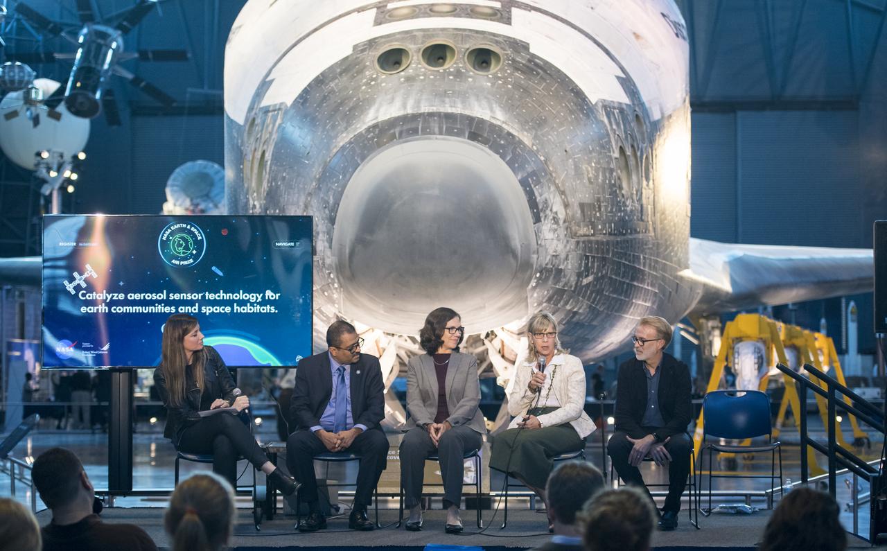 Lynn Buquo, manager, NASA Center of Excellence for Collaborative Innovation, speaks on a panel on improving air quality for health in space and on Earth, at a pop-up makerspace hosted by Future Engineers with support from NASA and The American Society of Mechanical Engineers (ASME), at the Steven F. Udvar-Hazy Center, Thursday, September 21, 2017 in Chantilly, Virginia. Participants were able to create digital 3D models using Autodesk Tinkercad and watch objects being printed with Makerbot 3D printers. Photo Credit: (NASA/Aubrey Gemignani)