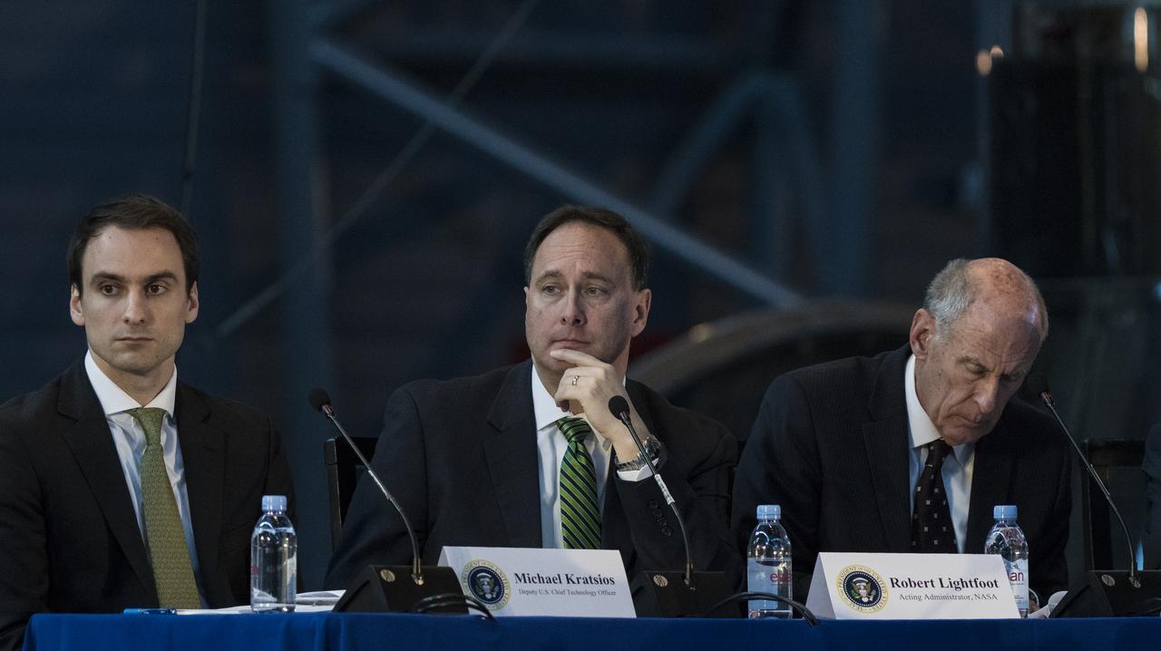 Acting NASA Administrator Robert Lightfoot, center, along with Deputy Chief Technology Officer of the United States Michael Kratsios, left, and Director of National Intelligence Daniel Coats, right, listen to remarks by panelists during the National Space Council's first meeting, Thursday, Oct. 5, 2017 at the Smithsonian National Air and Space Museum's Steven F. Udvar-Hazy Center in Chantilly, Va. The National Space Council, chaired by Vice President Mike Pence heard testimony from representatives from civil space, commercial space, and national security space industry representatives.  Photo Credit: (NASA/Joel Kowsky)