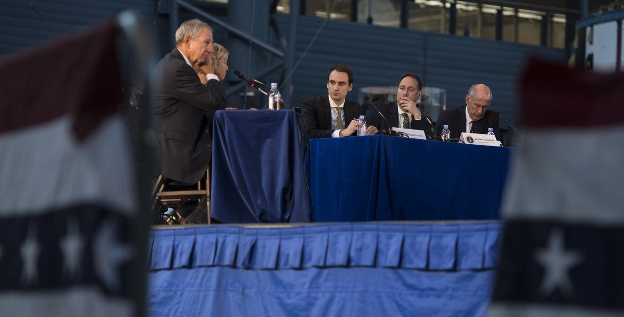 Acting NASA Administrator Robert Lightfoot, center, along with Deputy Chief Technology Officer of the United States Michael Kratsios, left, and Director of National Intelligence Daniel Coats, right, listen to remarks by panelists during the National Space Council's first meeting, Thursday, Oct. 5, 2017 at the Smithsonian National Air and Space Museum's Steven F. Udvar-Hazy Center in Chantilly, Va. The National Space Council, chaired by Vice President Mike Pence heard testimony from representatives from civil space, commercial space, and national security space industry representatives.  Photo Credit: (NASA/Joel Kowsky)