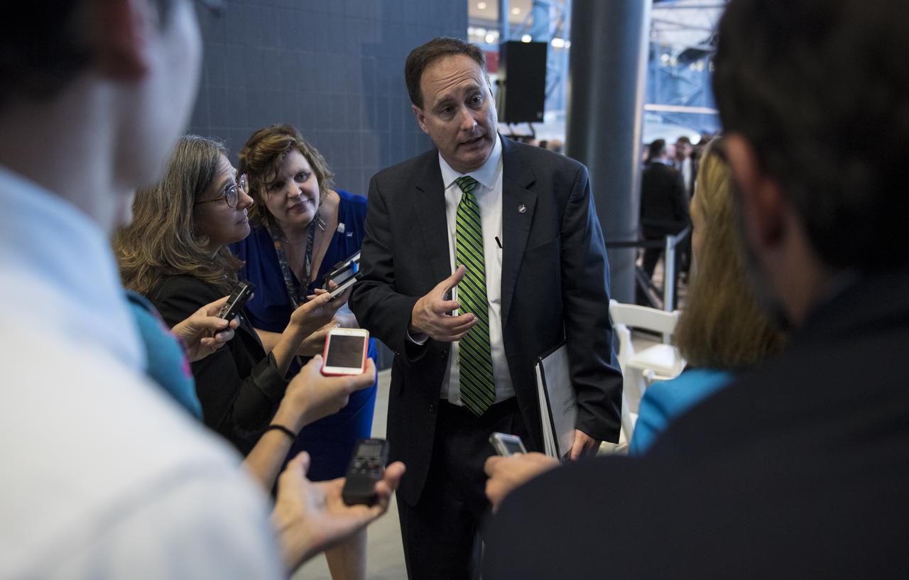 Acting NASA Administrator Robert Lightfoot answers questions from reporters following the National Space Council's first meeting, Thursday, Oct. 5, 2017 at the Smithsonian National Air and Space Museum's Steven F. Udvar-Hazy Center in Chantilly, Va. The National Space Council, chaired by Vice President Mike Pence heard testimony from representatives from civil space, commercial space, and national security space industry representatives.  Photo Credit: (NASA/Joel Kowsky)