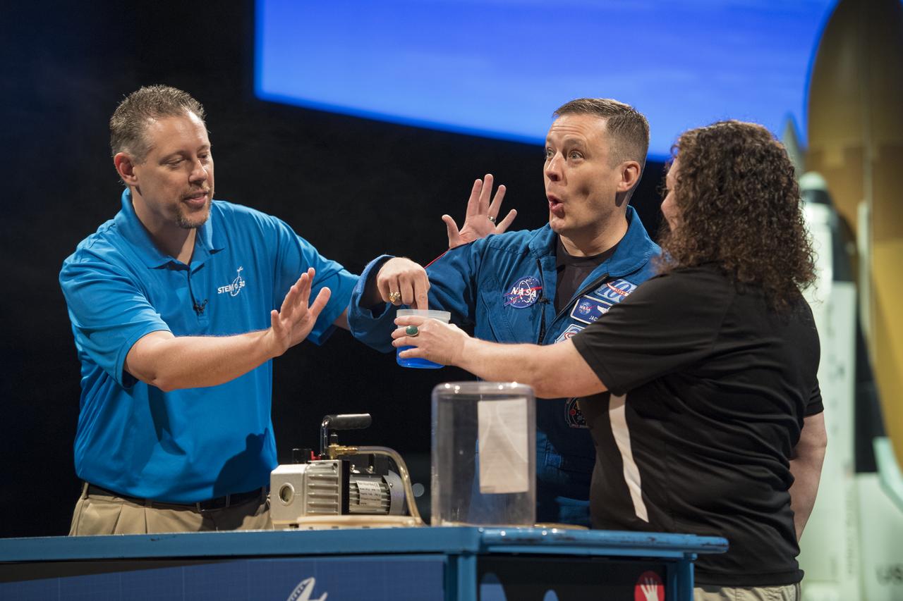 NASA astronaut Jack Fischer sticks his finger in a liquid that was just boiling by vacuum, during a Stem in 30 experiment, Friday, Nov. 3, 2017 at Smithsonian's National Air and Space Museum in Washington. During Expedition 52, Fischer completed hundreds of scientific experiments and two spacewalks, and concluded his 136-day mission onboard the International Space Station, when he landed in a remote area near the town of Zhezkazgan, Kazakhstan in September 2017. Photo Credit: (NASA/Aubrey Gemignani)