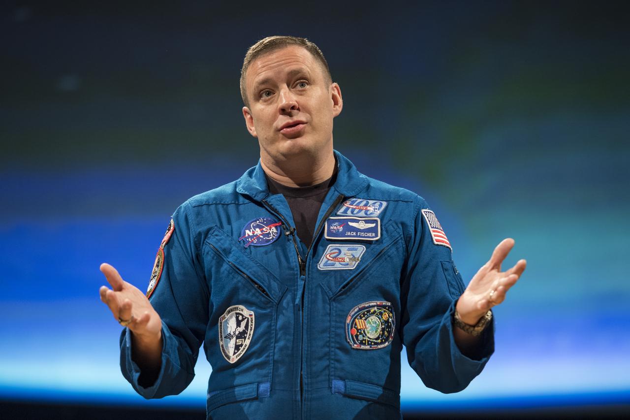 NASA astronaut Jack Fischer speaks about his time onboard the International Space Station (ISS) during Expeditions 51/52, Friday, Nov. 3, 2017 at Smithsonian's National Air and Space Museum in Washington. During Expedition 52, Fischer completed hundreds of scientific experiments and two spacewalks, and concluded his 136-day mission when he landed in a remote area near the town of Zhezkazgan, Kazakhstan in September 2017. Photo Credit: (NASA/Aubrey Gemignani)
