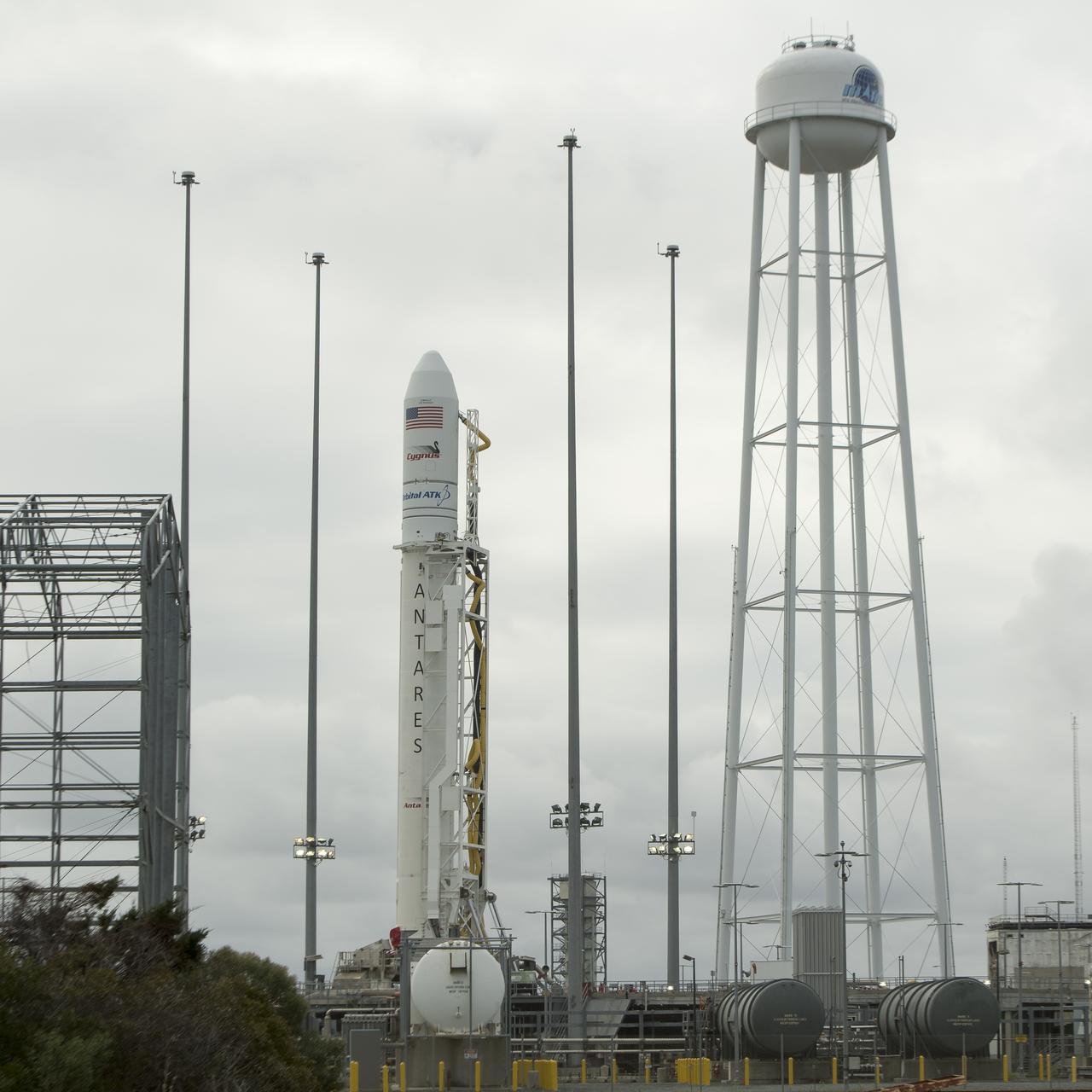 The Orbital ATK Antares rocket, with the Cygnus spacecraft onboard, is raised into the vertical position on launch Pad-0A, Thursday, Nov. 9, 2017 at NASA's Wallops Flight Facility in Virginia. Orbital ATK’s eighth contracted cargo resupply mission with NASA to the International Space Station will deliver over 7,400 pounds of science and research, crew supplies and vehicle hardware to the orbital laboratory and its crew. Photo Credit: (NASA/Bill Ingalls)
