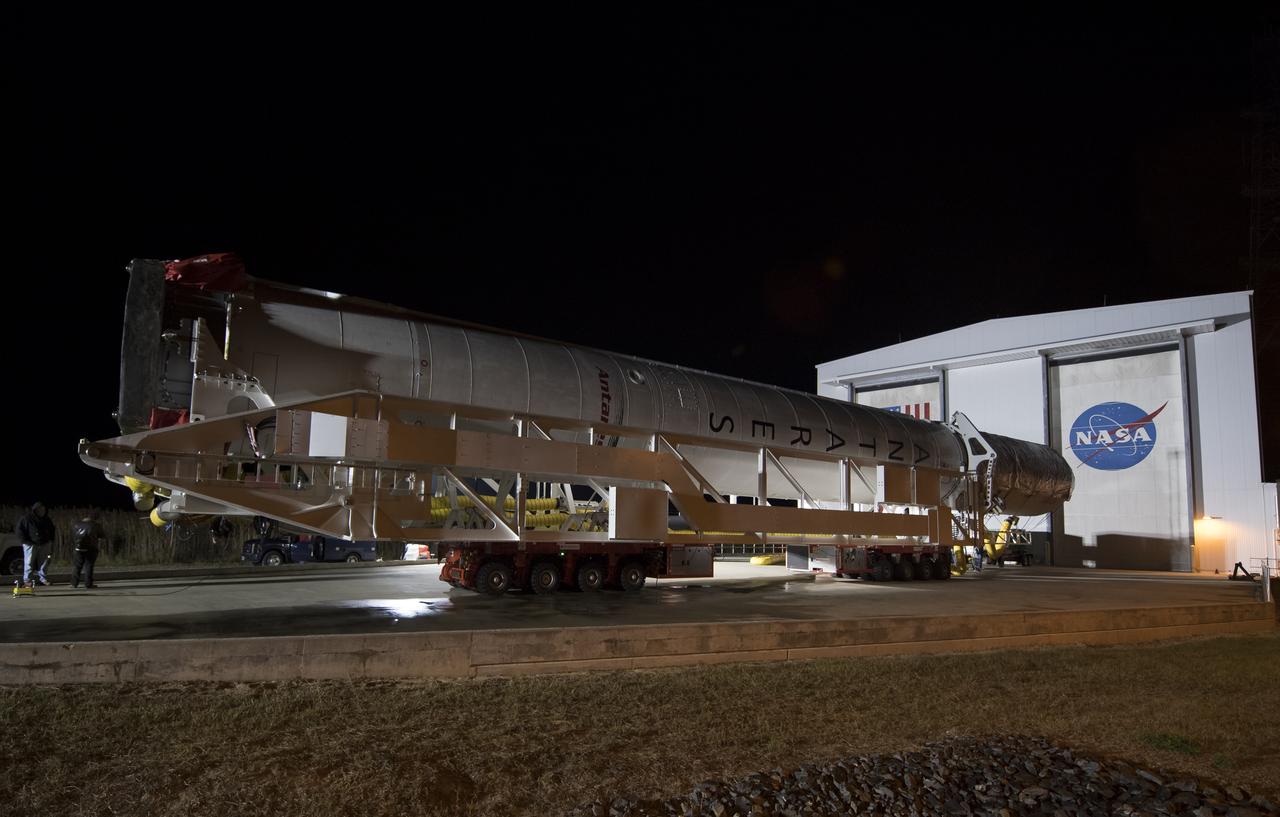 The Orbital ATK Antares rocket is rolled from the Horizontal Integration Facility (HIF) to launch Pad-0A, Thursday, Nov. 9, 2017 at NASA's Wallops Flight Facility in Virginia. Orbital ATK’s eighth contracted cargo resupply mission with NASA to the International Space Station will deliver over 7,400 pounds of science and research, crew supplies and vehicle hardware to the orbital laboratory and its crew. Photo Credit: (NASA/Bill Ingalls)