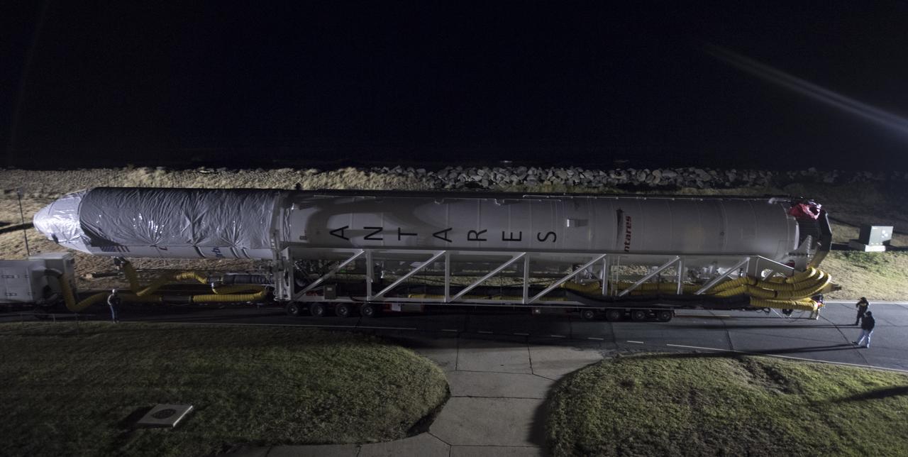 The Orbital ATK Antares rocket is rolled from the Horizontal Integration Facility (HIF) to launch Pad-0A, Thursday, Nov. 9, 2017 at NASA's Wallops Flight Facility in Virginia. Orbital ATK’s eighth contracted cargo resupply mission with NASA to the International Space Station will deliver over 7,400 pounds of science and research, crew supplies and vehicle hardware to the orbital laboratory and its crew. Photo Credit: (NASA/Bill Ingalls)