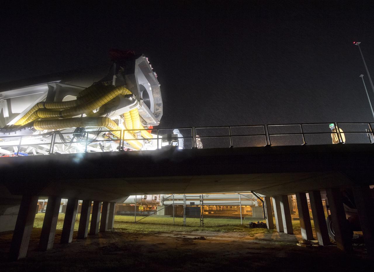 The Orbital ATK Antares rocket is rolled from the Horizontal Integration Facility (HIF) to launch Pad-0A, Thursday, Nov. 9, 2017 at NASA's Wallops Flight Facility in Virginia. Orbital ATK’s eighth contracted cargo resupply mission with NASA to the International Space Station will deliver over 7,400 pounds of science and research, crew supplies and vehicle hardware to the orbital laboratory and its crew. Photo Credit: (NASA/Bill Ingalls)