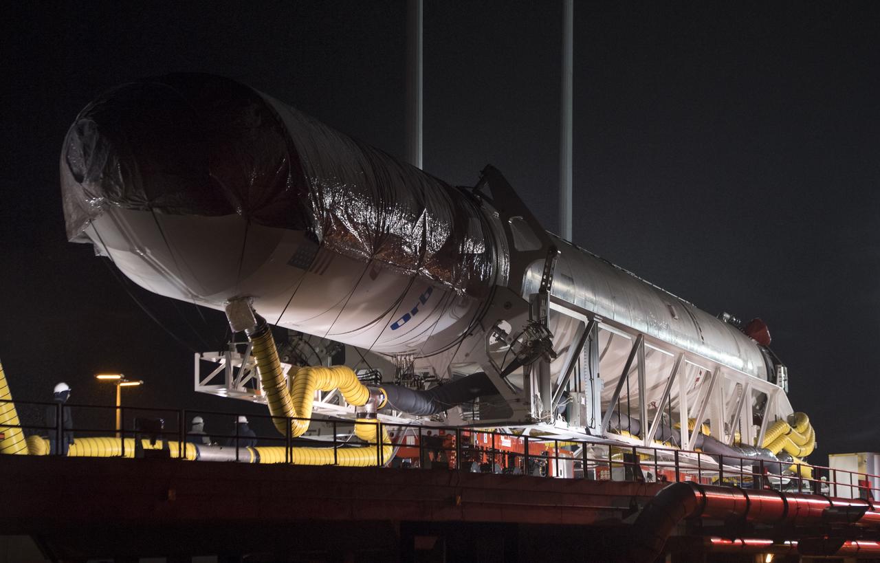 The Orbital ATK Antares rocket is rolled from the Horizontal Integration Facility (HIF) to launch Pad-0A, Thursday, Nov. 9, 2017 at NASA's Wallops Flight Facility in Virginia. Orbital ATK’s eighth contracted cargo resupply mission with NASA to the International Space Station will deliver over 7,400 pounds of science and research, crew supplies and vehicle hardware to the orbital laboratory and its crew. Photo Credit: (NASA/Bill Ingalls)