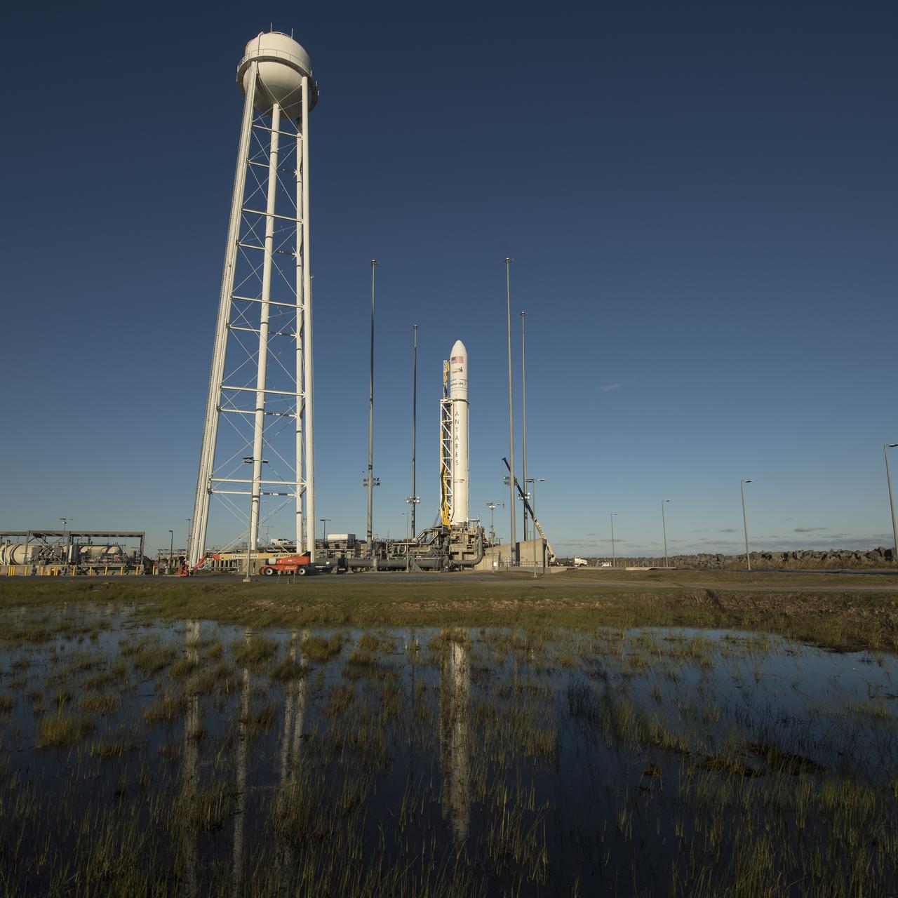 The Orbital ATK Antares rocket, with the Cygnus spacecraft onboard, is seen on launch Pad-0A, Friday, Nov. 10, 2017 at NASA's Wallops Flight Facility in Virginia. Orbital ATK’s eighth contracted cargo resupply mission with NASA to the International Space Station will deliver approximately 7,400 pounds of science and research, crew supplies and vehicle hardware to the orbital laboratory and its crew. Photo Credit: (NASA/Bill Ingalls)