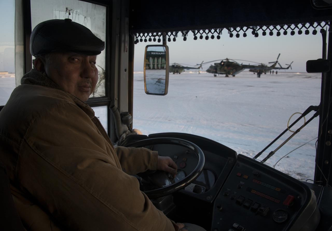 A bus driver picks up Russian Search and Rescue teams after they arrived at the Zhezkazgan Airport in Kazakhstan, Wednesday, Dec. 13, 2017.  Teams are preparing for the Soyuz MS-05 landing with Expedition 53 Commander Randy Bresnik of NASA and Flight Engineers Paolo Nespoli of ESA (European Space Agency) and Sergey Ryazanskiy of the Russian space agency Roscosmos. Bresnik, Nespoli and Ryazanskiy are returning after 139 days in space where they served as members of the Expedition 52 and 53 crews onboard the International Space Station. Photo Credit: (NASA/Bill Ingalls)
