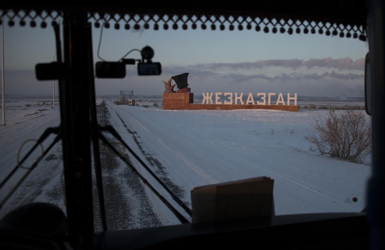 The bus carrying NASA, Roscosmos, ESA (European Space Agency), along with Russian Search and Rescue teams approaches the town of Zhezkazgan, Kazakhstan, Wednesday, Dec. 13, 2017. Teams are gathering to prepare for the Soyuz MS-05 landing with Expedition 53 Commander Randy Bresnik of NASA and Flight Engineers Paolo Nespoli of ESA (European Space Agency) and Sergey Ryazanskiy of the Russian space agency Roscosmos. Bresnik, Nespoli and Ryazanskiy are returning after 139 days in space where they served as members of the Expedition 52 and 53 crews onboard the International Space Station. Photo Credit: (NASA/Bill Ingalls)