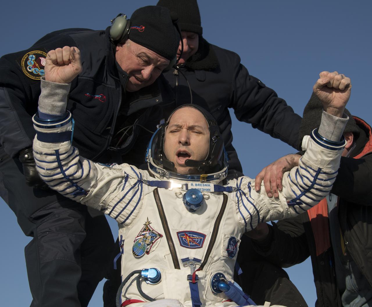 NASA astronaut Randy Bresnik is helped out of the Soyuz MS-05 spacecraft just minutes after he, ESA (European Space Agency) astronaut Paolo Nespoli, and Roscosmos cosmonaut Sergey Ryazanskiy, landed in a remote area near the town of Zhezkazgan, Kazakhstan on Thursday, Dec. 14, 2017. Bresnik, Nespoli and Ryazanskiy are returning after 139 days in space where they served as members of the Expedition 52 and 53 crews onboard the International Space Station. Photo Credit: (NASA/Bill Ingalls)