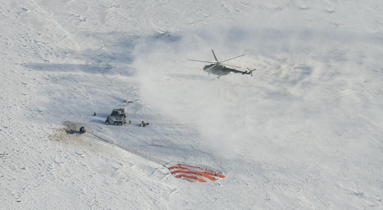 Russian Search and Rescue teams arrive at the Soyuz MS-05 spacecraft shortly after it landed with Expedition 53 Commander Randy Bresnik of NASA and Flight Engineers Paolo Nespoli of ESA (European Space Agency) and Sergey Ryazanskiy of the Russian space agency Roscosmos near the town of Zhezkazgan, Kazakhstan on Thursday, Dec. 14, 2017. Bresnik, Nespoli and Ryazanskiy are returning after 139 days in space where they served as members of the Expedition 52 and 53 crews onboard the International Space Station. Photo Credit: (NASA/Bill Ingalls)