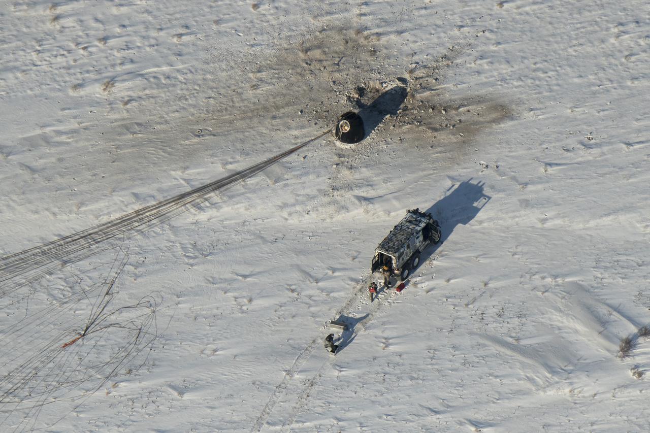 Russian Search and Rescue teams arrive at the Soyuz MS-05 spacecraft shortly after it landed with Expedition 53 Commander Randy Bresnik of NASA and Flight Engineers Paolo Nespoli of ESA (European Space Agency) and Sergey Ryazanskiy of the Russian space agency Roscosmos near the town of Zhezkazgan, Kazakhstan on Thursday, Dec. 14, 2017. Bresnik, Nespoli and Ryazanskiy are returning after 139 days in space where they served as members of the Expedition 52 and 53 crews onboard the International Space Station. Photo Credit: (NASA/Bill Ingalls)