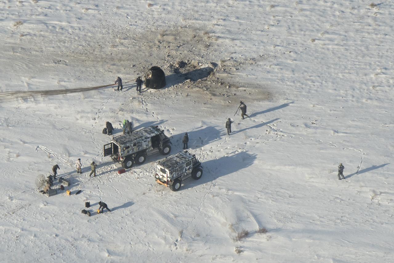 Russian Search and Rescue teams arrive at the Soyuz MS-05 spacecraft shortly after it landed with Expedition 53 Commander Randy Bresnik of NASA and Flight Engineers Paolo Nespoli of ESA (European Space Agency) and Sergey Ryazanskiy of the Russian space agency Roscosmos near the town of Zhezkazgan, Kazakhstan on Thursday, Dec. 14, 2017. Bresnik, Nespoli and Ryazanskiy are returning after 139 days in space where they served as members of the Expedition 52 and 53 crews onboard the International Space Station. Photo Credit: (NASA/Bill Ingalls)