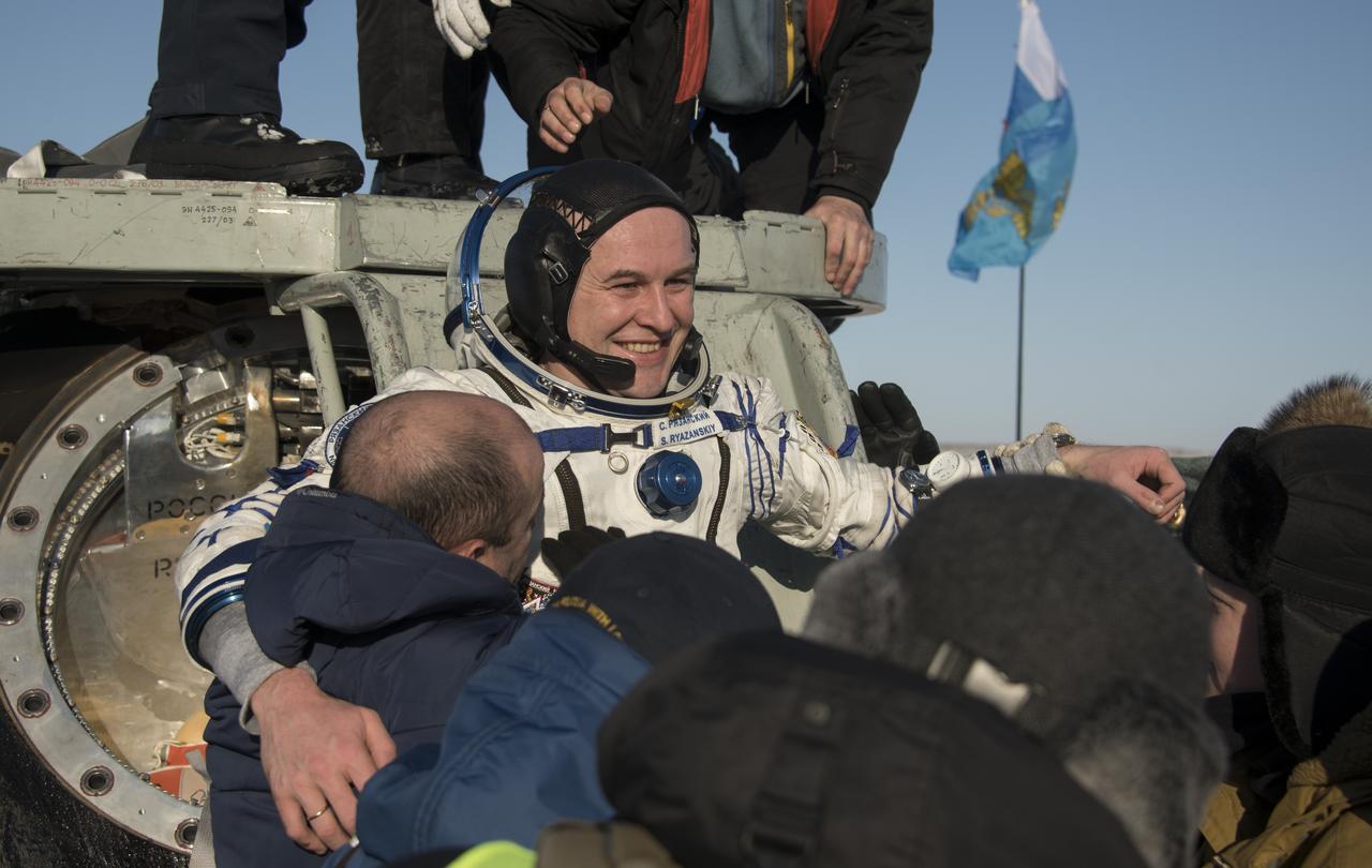 Roscosmos cosmonaut Sergey Ryazanskiy is helped out of the Soyuz MS-05 spacecraft just minutes after he, NASA astronaut Randy Bresnik, and ESA (European Space Agency) astronaut Paolo Nespoli, landed in a remote area near the town of Zhezkazgan, Kazakhstan on Thursday, Dec. 14, 2017. Bresnik, Nespoli and Ryazanskiy are returning after 139 days in space where they served as members of the Expedition 52 and 53 crews onboard the International Space Station. Photo Credit: (NASA/Bill Ingalls)