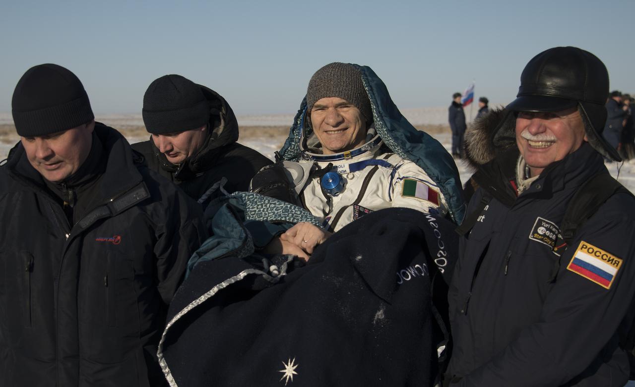 ESA (European Space Agency) astronaut Paolo Nespoli is carried to the medical tent shortly after he and NASA astronaut Randy Bresnik, and Roscosmos cosmonaut Sergey Ryazanskiy landed in their Soyuz MS-05 spacecraft in a remote area near the town of Zhezkazgan, Kazakhstan on Thursday, Dec. 14, 2017. Bresnik, Nespoli and Ryazanskiy are returning after 139 days in space where they served as members of the Expedition 52 and 53 crews onboard the International Space Station. Photo Credit: (NASA/Bill Ingalls)