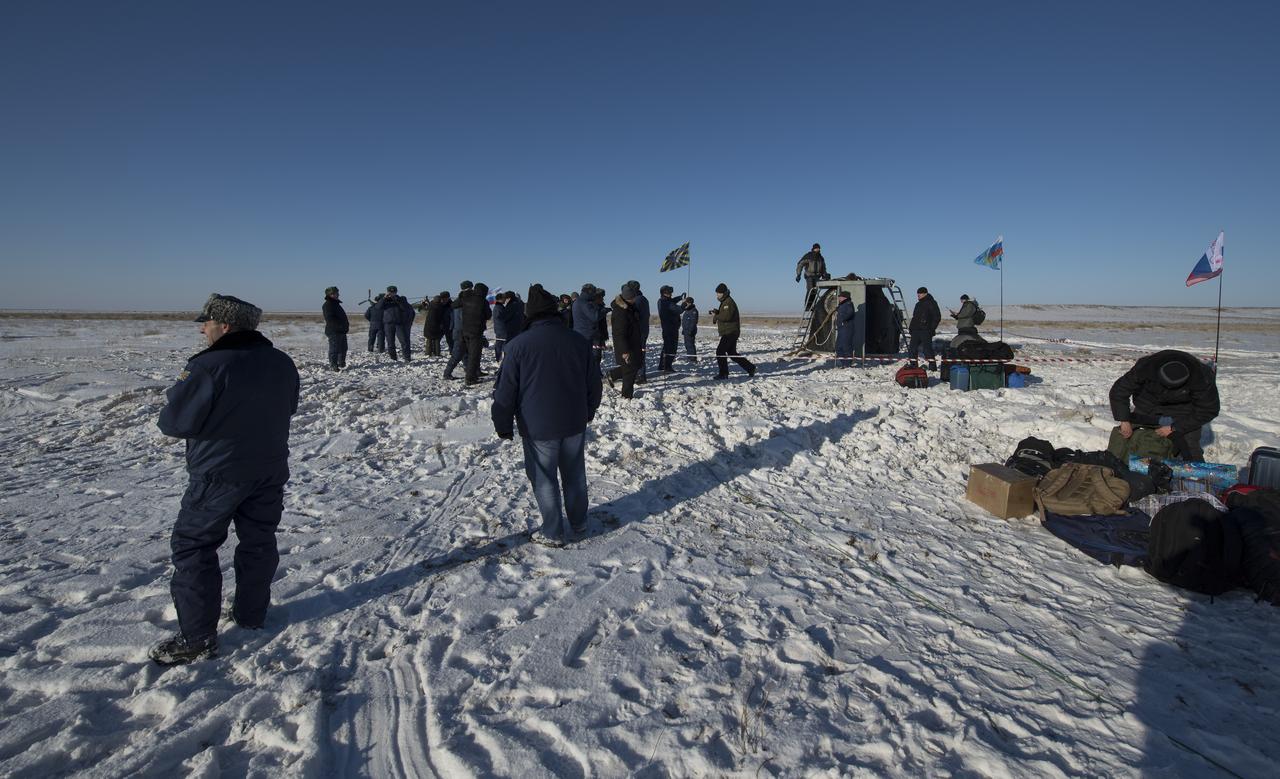 Russian support personnel work around the Soyuz MS-05 spacecraft shortly after it landed with Expedition 53 Commander Randy Bresnik of NASA and Flight Engineers Paolo Nespoli of ESA (European Space Agency) and Sergey Ryazanskiy of the Russian space agency Roscosmos near the town of Zhezkazgan, Kazakhstan on Thursday, Dec. 14, 2017. Bresnik, Nespoli and Ryazanskiy are returning after 139 days in space where they served as members of the Expedition 52 and 53 crews onboard the International Space Station. Photo Credit: (NASA/Bill Ingalls)
