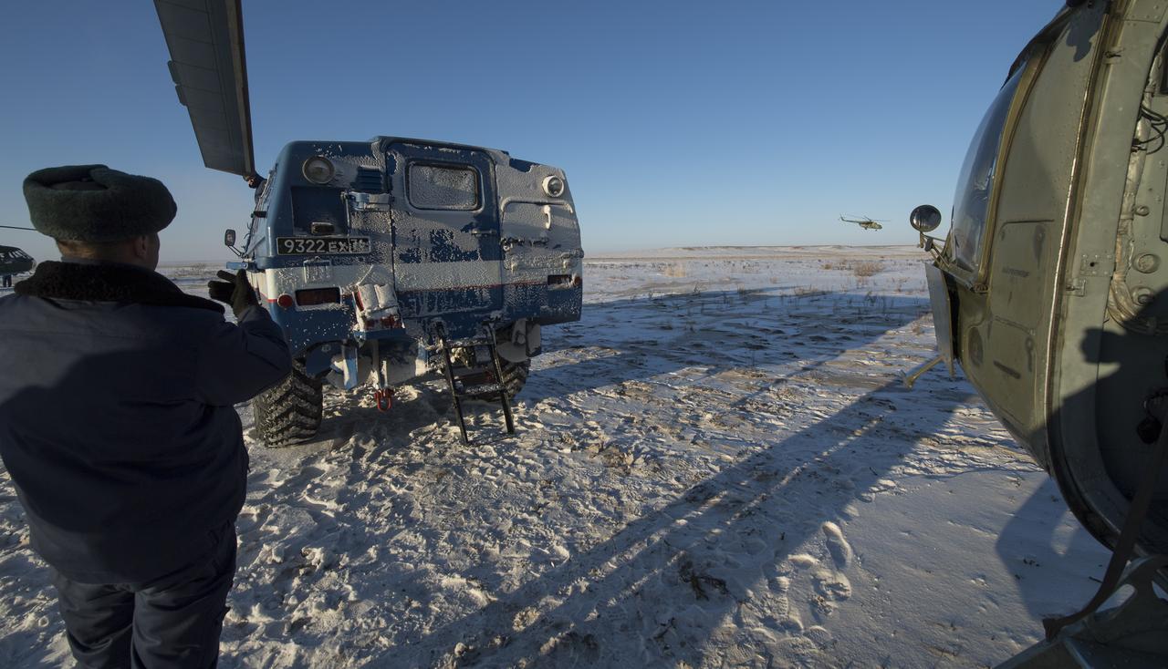 A Russian All-Terrain Vehicle (ATV) delivers NASA astronaut Randy Bresnik to an awaiting helicopter shortly after he, ESA (European Space Agency) astronaut Paolo Nespoli, and Roscosmos cosmonaut Sergey Ryazanskiy landed in their Soyuz MS-05 spacecraft in a remote area near the town of Zhezkazgan, Kazakhstan on Thursday, Dec. 14, 2017. Bresnik, Nespoli and Ryazanskiy are returning after 139 days in space where they served as members of the Expedition 52 and 53 crews onboard the International Space Station. Photo Credit: (NASA/Bill Ingalls)