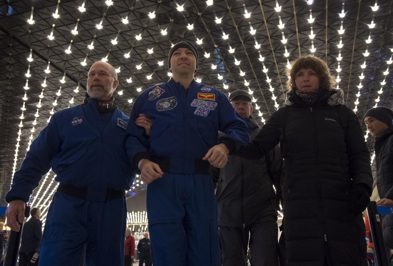 NASA astronaut Randy Bresnik, center, arrives at the Karaganda Airport in Kazakhstan airport after he, Roscosmos cosmonaut Sergey Ryazanskiy and, ESA (European Space Agency) astronaut Paolo Nespoli landed in their Soyuz MS-05 spacecraft in a remote area near the town of Zhezkazgan, Kazakhstan on Thursday, Dec. 14, 2017. Bresnik, Nespoli and Ryazanskiy are returning after 139 days in space where they served as members of the Expedition 52 and 53 crews onboard the International Space Station. Photo Credit: (NASA/Bill Ingalls)