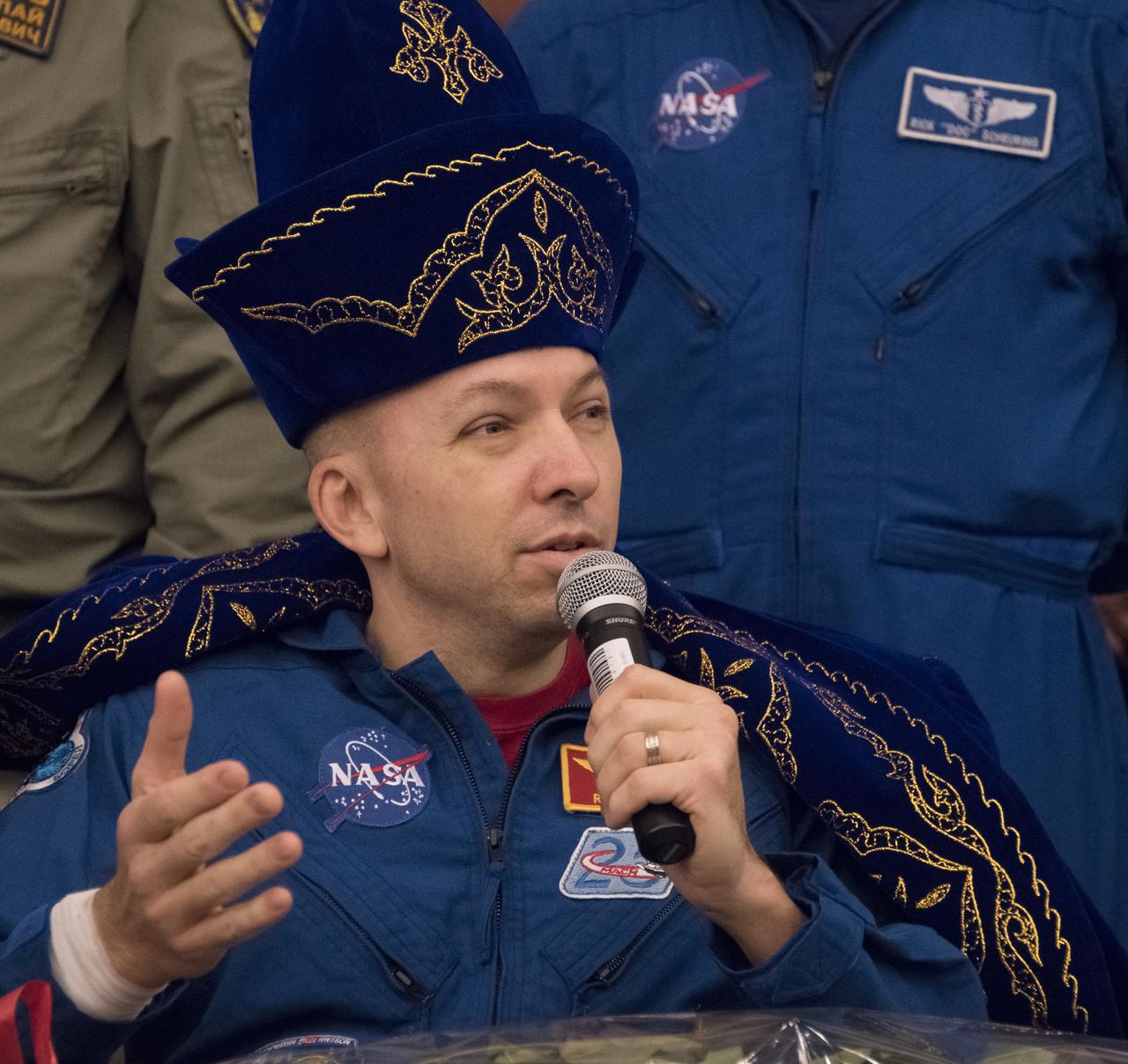 Expedition 53 Commander Randy Bresnik of NASA answers a question during a Karaganda Airport welcome ceremony in Kazakhstan on Thursday, Dec. 14, 2017. 2017. Bresnik, ESA (European Space Agency) astronaut Paolo Nespoli, and Roscosmos cosmonaut Sergey Ryazanskiy are returning after 139 days in space where they served as members of the Expedition 52 and 53 crews onboard the International Space Station. Photo Credit: (NASA/Bill Ingalls)