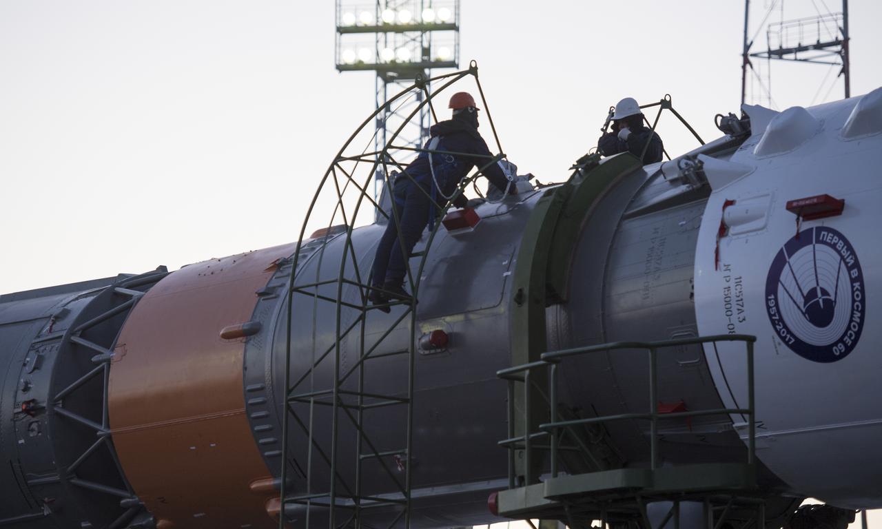 Workers prepare to raise the Soyuz rocket into a vertical position on the launch pad, Friday, Dec. 15, 2017 at the Baikonur Cosmodrome in Kazakhstan. Expedition 54 Soyuz Commander Anton Shkaplerov of Roscosmos, flight engineer Scott Tingle of NASA, and flight engineer Norishige Kanai of the Japan Aerospace Exploration Agency (JAXA) are scheduled to launch at 2:21 a.m. Eastern Time (1:21 p.m. Baikonur time) on Dec. 17 and will spend the next five months living and working aboard the International Space Station. Photo Credit: (NASA/Joel Kowsky)