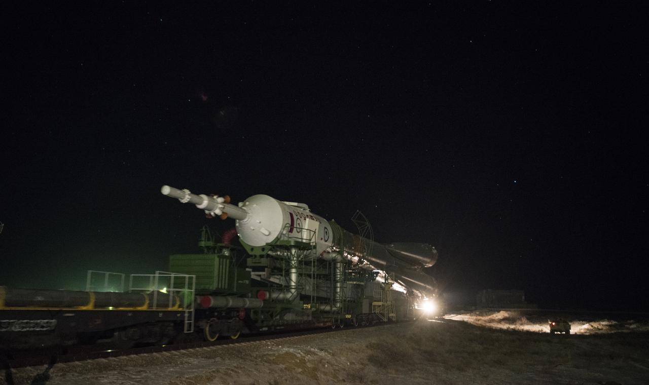 The Soyuz rocket is rolled out by train to the launch pad, Friday, Dec. 15, 2017 at the Baikonur Cosmodrome in Kazakhstan. Expedition 54 Soyuz Commander Anton Shkaplerov of Roscosmos, flight engineer Scott Tingle of NASA, and flight engineer Norishige Kanai of the Japan Aerospace Exploration Agency (JAXA) are scheduled to launch at 2:21 a.m. Eastern Time (1:21 p.m. Baikonur time) on Dec. 17 and will spend the next five months living and working aboard the International Space Station.  Photo Credit: (NASA/Joel Kowsky)