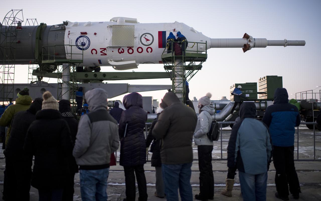 Workers prepare to raise the Soyuz rocket into a vertical position on the pad, Friday, Dec. 15, 2017 at the Baikonur Cosmodrome in Kazakhstan. Expedition 54 Soyuz Commander Anton Shkaplerov of Roscosmos, flight engineer Scott Tingle of NASA, and flight engineer Norishige Kanai of the Japan Aerospace Exploration Agency (JAXA) are scheduled to launch at 2:21 a.m. Eastern Time (1:21 p.m. Baikonur time) on Dec. 17 and will spend the next five months living and working aboard the International Space Station. Photo Credit: (NASA/Joel Kowsky)