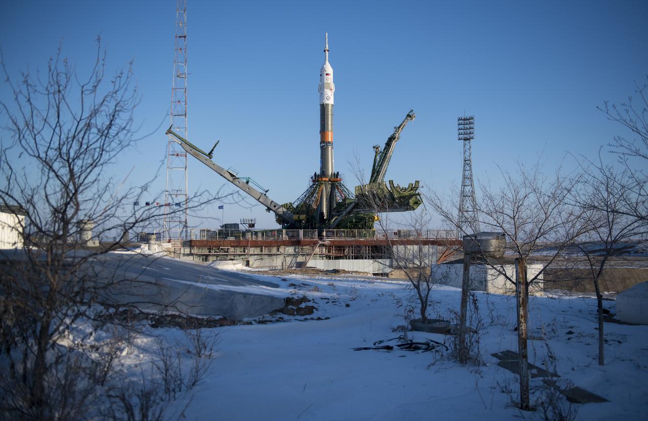 The Soyuz rocket is seen on the launch pad as the service structure arms are closed around it, Friday, Dec. 15, 2017 at the Baikonur Cosmodrome in Kazakhstan. Expedition 54 Soyuz Commander Anton Shkaplerov of Roscosmos, flight engineer Scott Tingle of NASA, and flight engineer Norishige Kanai of the Japan Aerospace Exploration Agency (JAXA) are scheduled to launch at 2:21 a.m. Eastern Time (1:21 p.m. Baikonur time) on Dec. 17 and will spend the next five months living and working aboard the International Space Station. Photo Credit: (NASA/Joel Kowsky)
