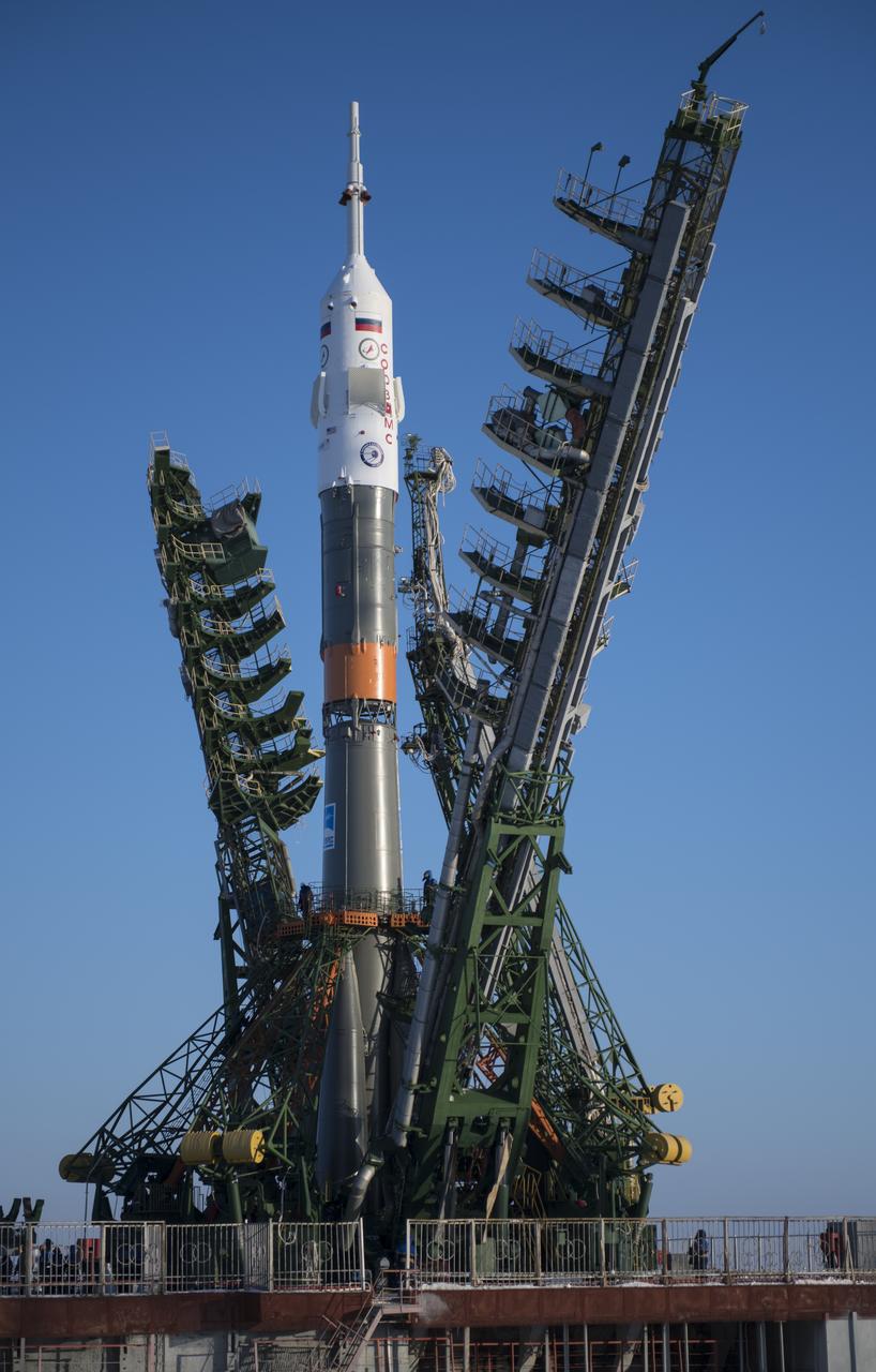 The Soyuz rocket is seen on the launch pad as the service structure arms are closed around it, Friday, Dec. 15, 2017 at the Baikonur Cosmodrome in Kazakhstan. Expedition 54 Soyuz Commander Anton Shkaplerov of Roscosmos, flight engineer Scott Tingle of NASA, and flight engineer Norishige Kanai of the Japan Aerospace Exploration Agency (JAXA) are scheduled to launch at 2:21 a.m. Eastern Time (1:21 p.m. Baikonur time) on Dec. 17 and will spend the next five months living and working aboard the International Space Station. Photo Credit: (NASA/Joel Kowsky)