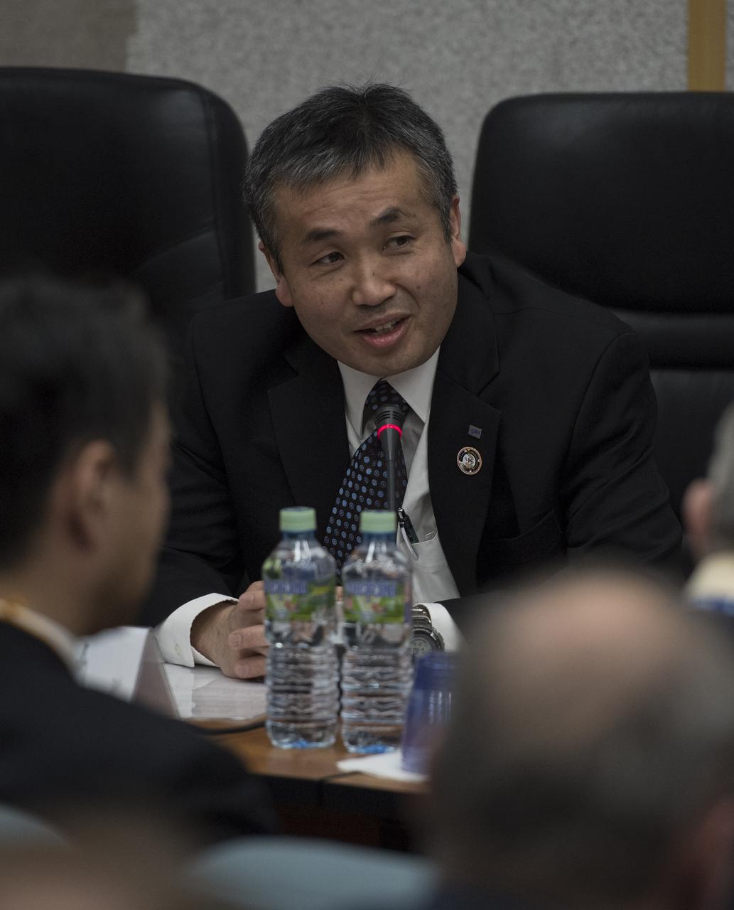 Japan Aerospace Exploration Agency (JAXA) International Space Station Program Manager Koichi Wakata is seen during the State Commission meeting to approve the Soyuz launch of Expedition 54 to the International Space Station, Saturday, Dec. 16, 2017 at the Cosmonaut Hotel in Baikonur, Kazakhstan. Expedition 54 Soyuz Commander Anton Shkaplerov of Roscosmos, flight engineer Scott Tingle of NASA, and flight engineer Norishige Kanai of the Japan Aerospace Exploration Agency (JAXA) are scheduled to launch to the International Space Station aboard the Soyuz spacecraft from the Baikonur Cosmodrome on December 17. Photo Credit: (NASA/Joel Kowsky)