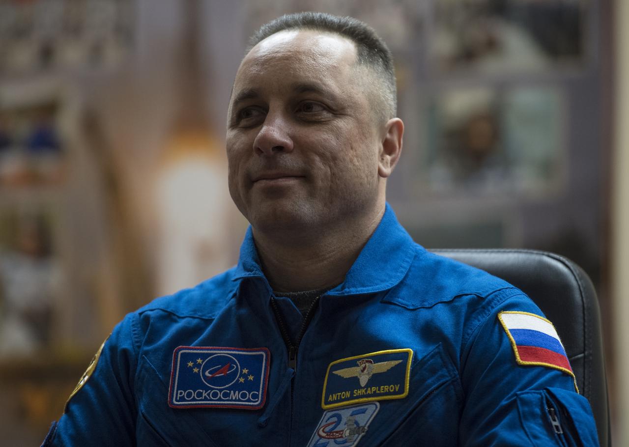 Expedition 54 Soyuz Commander Anton Shkaplerov of Roscosmos is seen in quarantine, behind glass, during a press conference, Saturday, Dec. 16, 2017 at the Cosmonaut Hotel in Baikonur, Kazakhstan. Shkaplerov, flight engineer Scott Tingle of NASA, and flight engineer Norishige Kanai of the Japan Aerospace Exploration Agency (JAXA) are scheduled to launch to the International Space Station aboard the Soyuz spacecraft from the Baikonur Cosmodrome on December 17.  Photo Credit: (NASA/Joel Kowsky)
