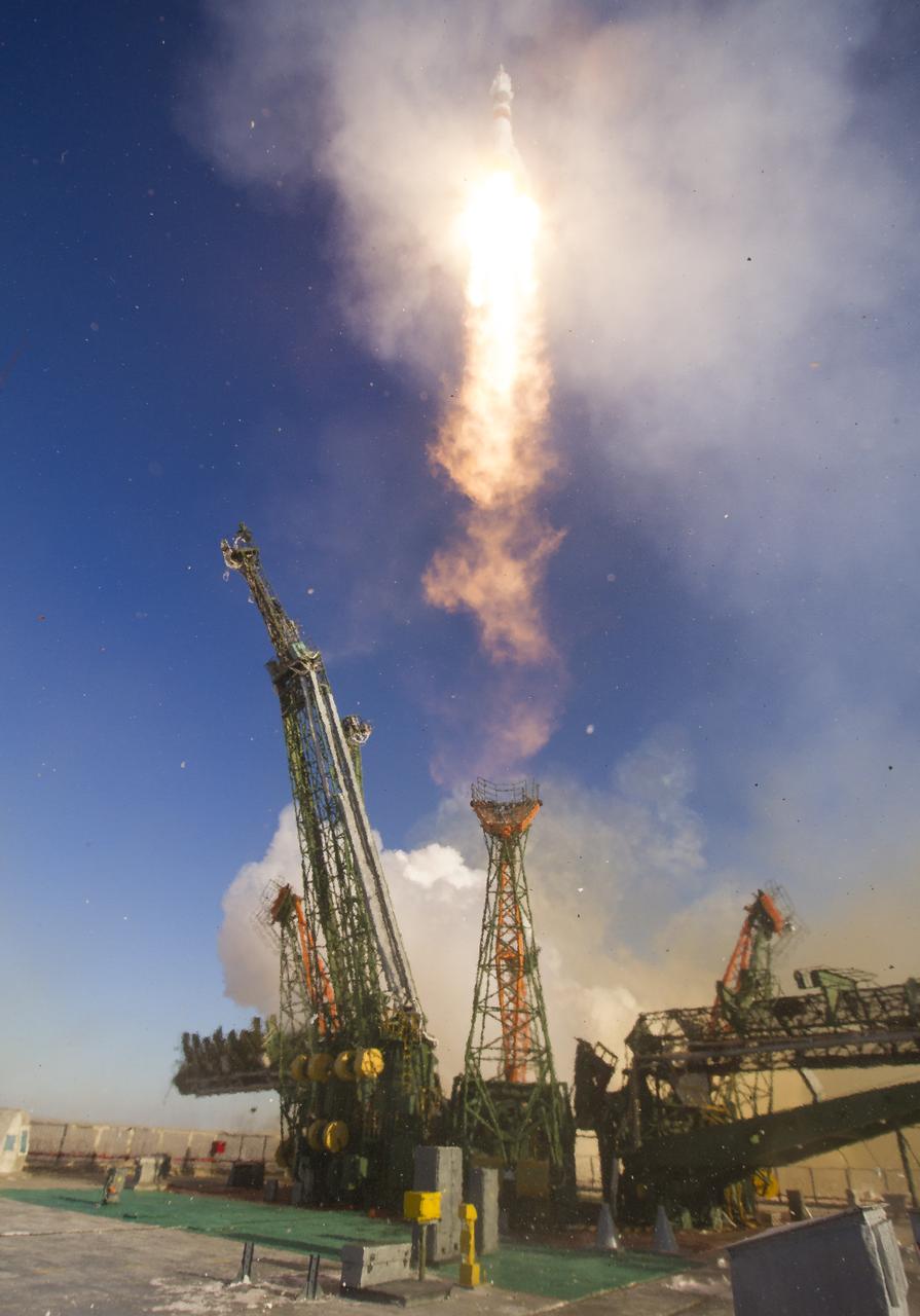 The Soyuz MS-07 rocket is launched with Expedition 54 Soyuz Commander Anton Shkaplerov of Roscosmos, flight engineer Scott Tingle of NASA, and flight engineer Norishige Kanai of Japan Aerospace Exploration Agency (JAXA), (iptcdow}, Dec. 17, 2017 at the Baikonur Cosmodrome in Kazakhstan. Shkaplerov, Tingle, and Kanai will spend the next five months living and working aboard the International Space Station. Photo Credit: (NASA/Joel Kowsky)