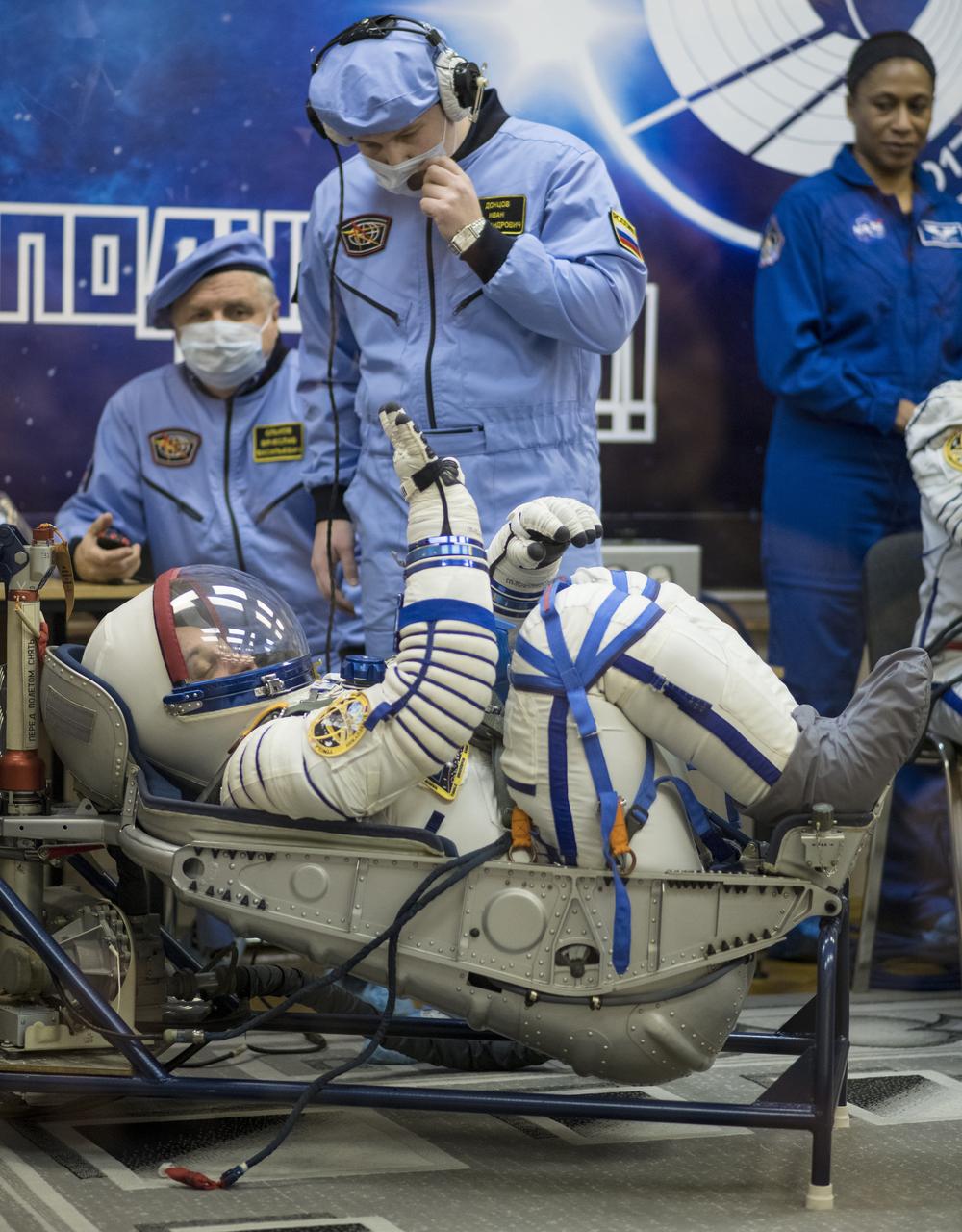 Expedition 54 Soyuz Commander Anton Shkaplerov of Roscosmos has his Russian Sokol suit pressure checked in preparation for launch aboard the Soyuz MS-07 spacecraft, Sunday, Dec. 17, 2017 at the Baikonur Cosmodrome Kazakhstan. Launch of the Soyuz rocket will send Shkaplerov and fellow crewmates flight engineer Scott Tingle of NASA and flight engineer Norishige Kanai of Japan Aerospace Exploration Agency (JAXA) on a five month mission aboard the International Space Station. Photo Credit: (NASA/Joel Kowsky)