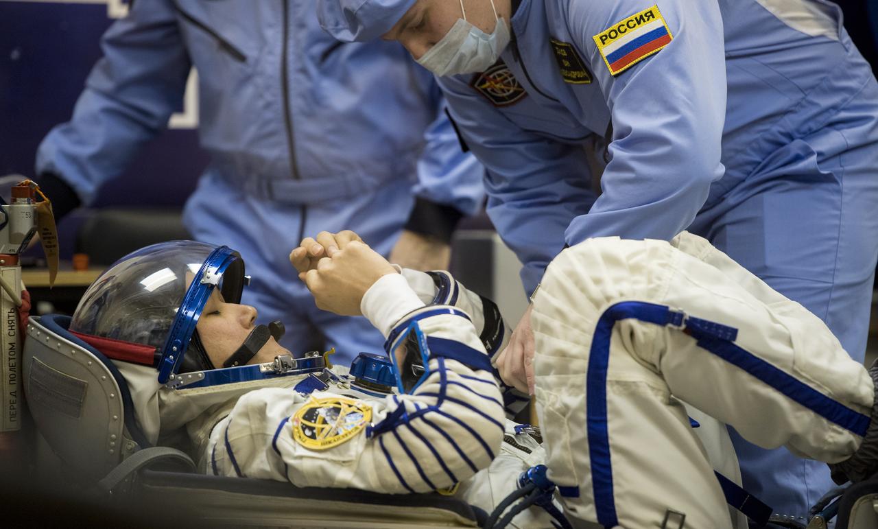 Expedition 54 flight engineer Norishige Kanai of the Japan Aerospace Exploration Agency (JAXA) prepares to have his Russian Sokol suit pressure checked in preparation for launch aboard the Soyuz MS-07 spacecraft, Sunday, Dec. 17, 2017 at the Baikonur Cosmodrome Kazakhstan. Launch of the Soyuz rocket will send Kanai and fellow crewmates Soyuz Commander Anton Shkaplerov of Roscosmos and flight engineer Scott Tingle of NASA on a five month mission aboard the International Space Station. Photo Credit: (NASA/Joel Kowsky)