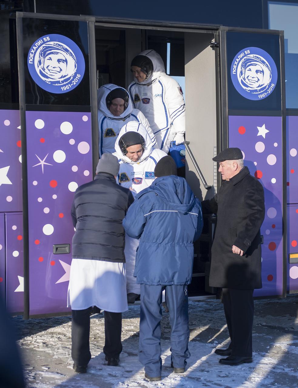 Expedition 54 flight engineer Norishige Kanai of the Japan Aerospace Exploration Agency (JAXA), top, flight engineer Scott Tingle of NASA, middle, and Soyuz Commander Anton Shkaplerov of Roscosmos, bottom, are seen as they arrive at the launch pad to board the Soyuz MS-07 rocket for launch, Sunday, Dec. 17, 2017 at the Baikonur Cosmodrome in Kazakhstan. Tingle, Norishige Kanai, and Shkaplerov will spend the next five months living and working aboard the International Space Station.  Photo Credit: (NASA/Joel Kowsky)