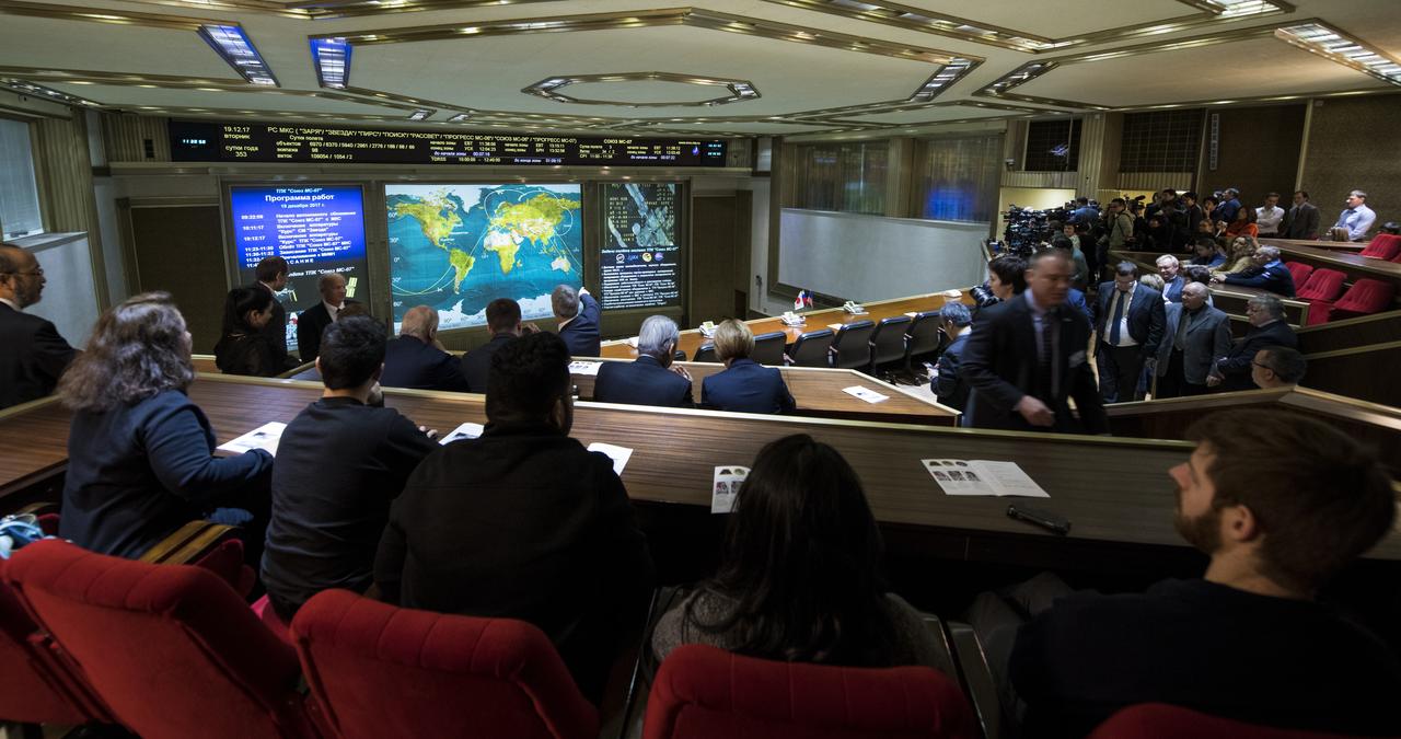 Friends and family members of the Soyuz MS-07 crew watch a live view of the International Space Station, as seen by cameras onboard the spacecraft with Expedition 54-55 crewmembers Anton Shkaplerov of Roscosmos, Scott Tingle of NASA, and Norishige Kanai of the Japan Aerospace Exploration Agency (JAXA) onboard, on screens at the Moscow Mission Control Center as the spacecraft approaches for docking, Tuesday, Dec. 19, 2017 in Korolev, Russia. The Soyuz MS-07 spacecraft carrying Shkaplerov, Tingle, and Kanai docked with the International Space Station at 3:39 a.m. EST, Tuesday, Dec. 19 while 250 statute miles over the southern coast of Italy and joined Expedition 54 Commander  Alexander Misurkin of Roscosmos, and NASA astronauts Joe Acaba and Mark Vande Hei. Photo Credit: (NASA/Joel Kowsky)