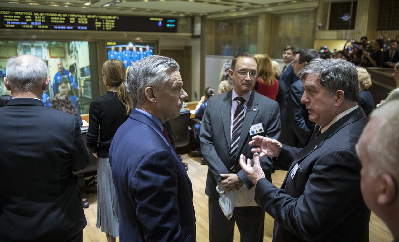 NASA International Space Station Program Manager Kirk Shireman, right, speaks with U.S. Ambassador to Russia Jon Huntsman Jr., left, at the Moscow Mission Control Center in Korolev, Russia a few hours after the Soyuz MS-07 docked to the International Space Station on Tuesday, Dec. 19, 2017.  Photo Credit: (NASA/Joel Kowsky)