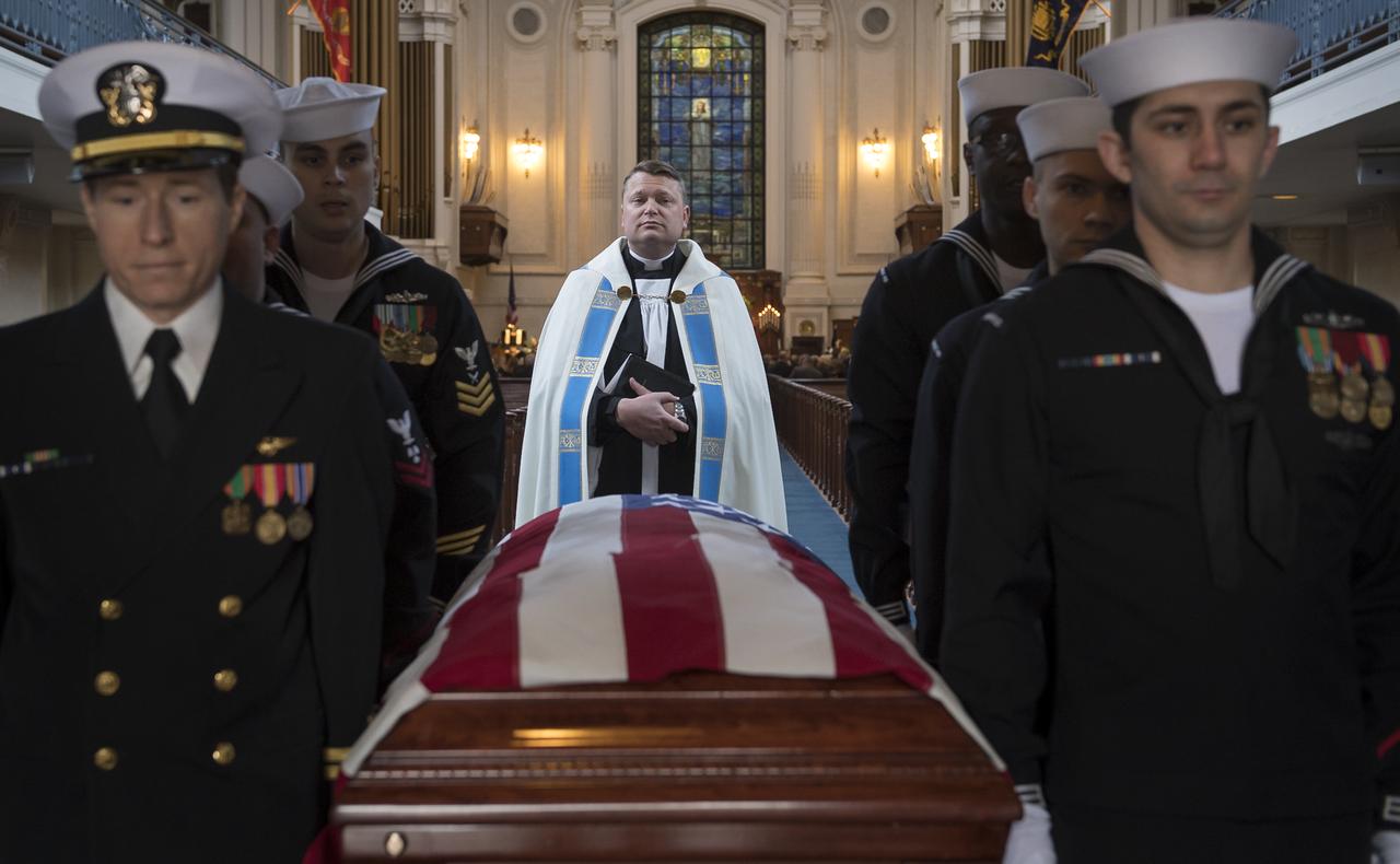 Chaplain McGrath over sees the funeral service for former NASA astronaut Captain Bruce McCandless II, USN (Ret.), Tuesday, Jan. 16, 2018 at the United States Naval Academy Chapel in Annapolis, Maryland. Photo Credit: (NASA/Bill Ingalls)