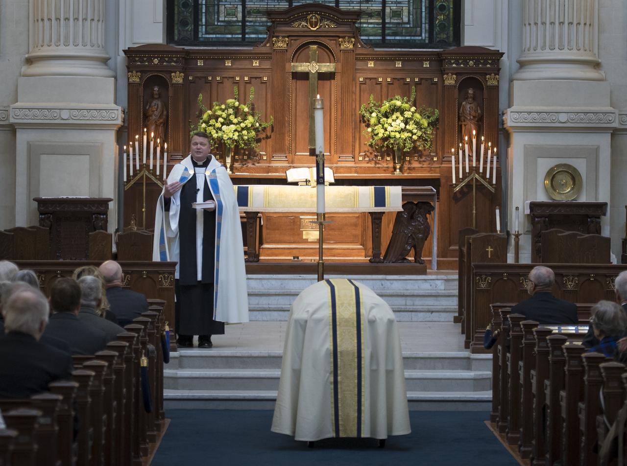 Chaplain McGrath over sees the funeral service for former NASA astronaut Captain Bruce McCandless II, USN (Ret.), Tuesday, Jan. 16, 2018 at the United States Naval Academy Chapel in Annapolis, Maryland. Photo Credit: (NASA/Bill Ingalls)
