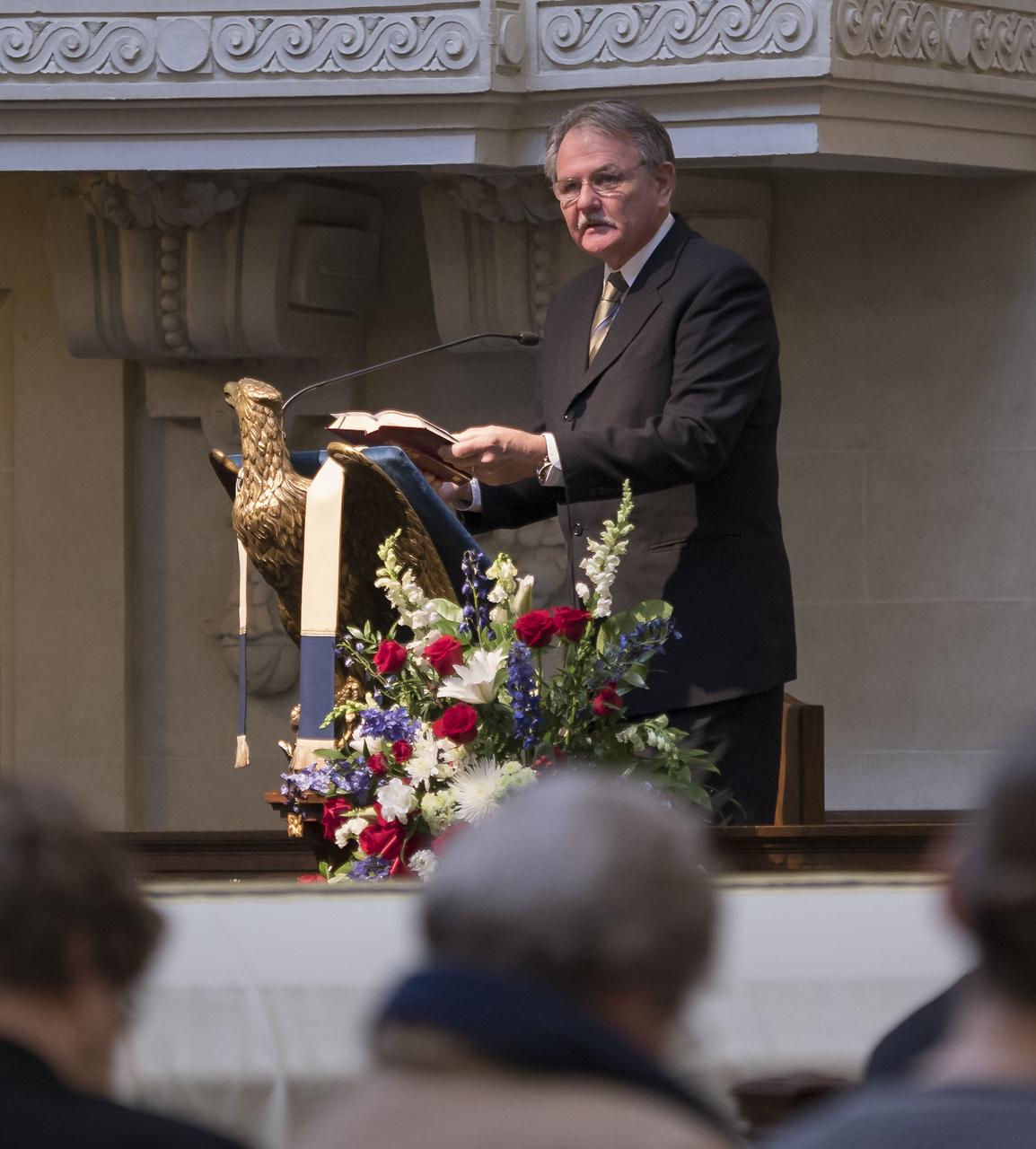 The Rev. Mark Anderson  talks during the funeral service for former NASA astronaut Captain Bruce McCandless II, USN (Ret.), Tuesday, Jan. 16, 2018 at the United States Naval Academy Chapel in Annapolis, Maryland. Photo Credit: (NASA/Bill Ingalls)