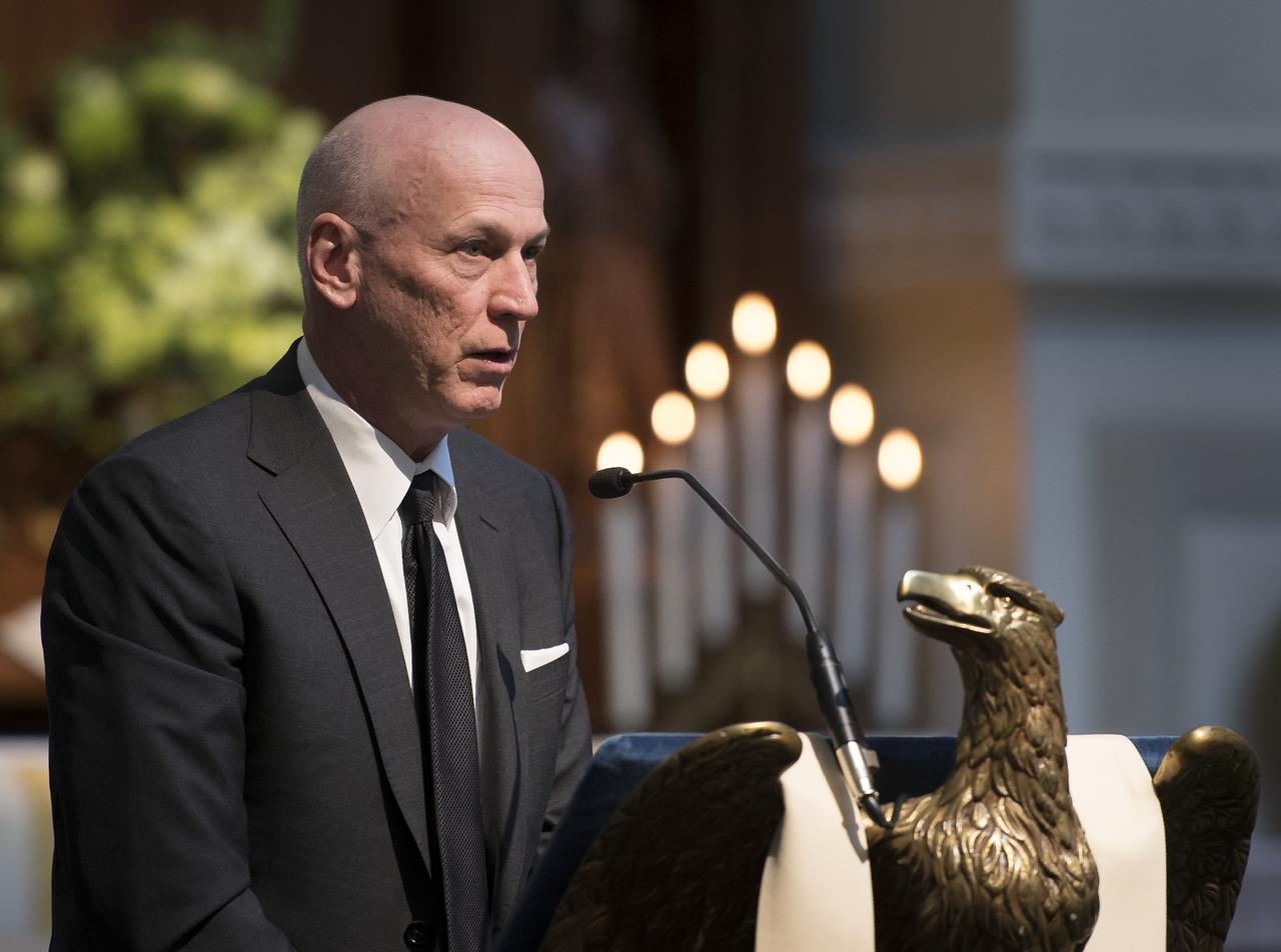 Bruce McCandless III gives remarks during the funeral service for his father, former NASA astronaut Captain Bruce McCandless II, USN (Ret.), Tuesday, Jan. 16, 2018 at the United States Naval Academy Chapel in Annapolis, Maryland. Photo Credit: (NASA/Bill Ingalls)