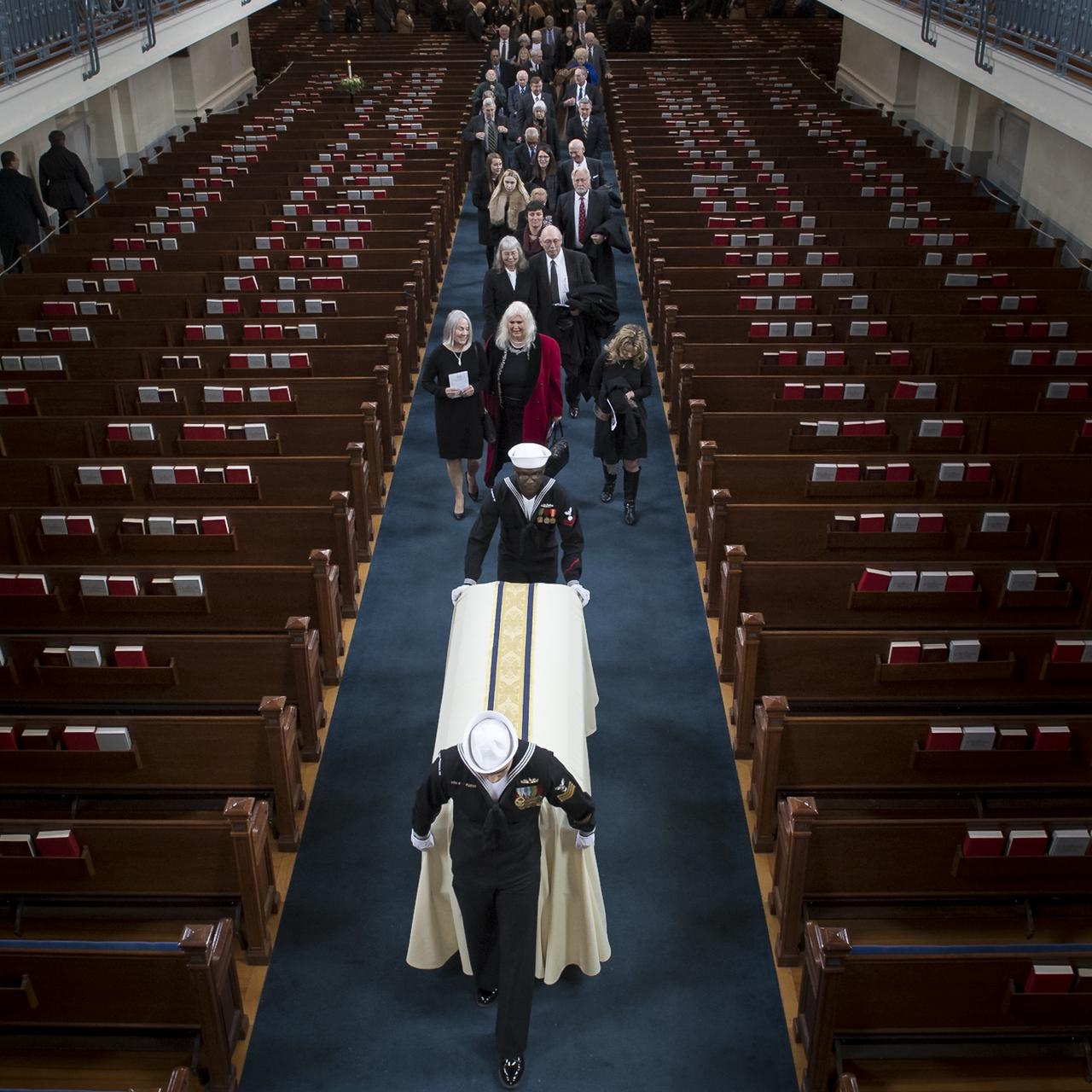 Family and friends depart the funeral service for former NASA astronaut Captain Bruce McCandless II, USN (Ret.), Tuesday, Jan. 16, 2018 at the United States Naval Academy Chapel in Annapolis, Maryland. Photo Credit: (NASA/Bill Ingalls)