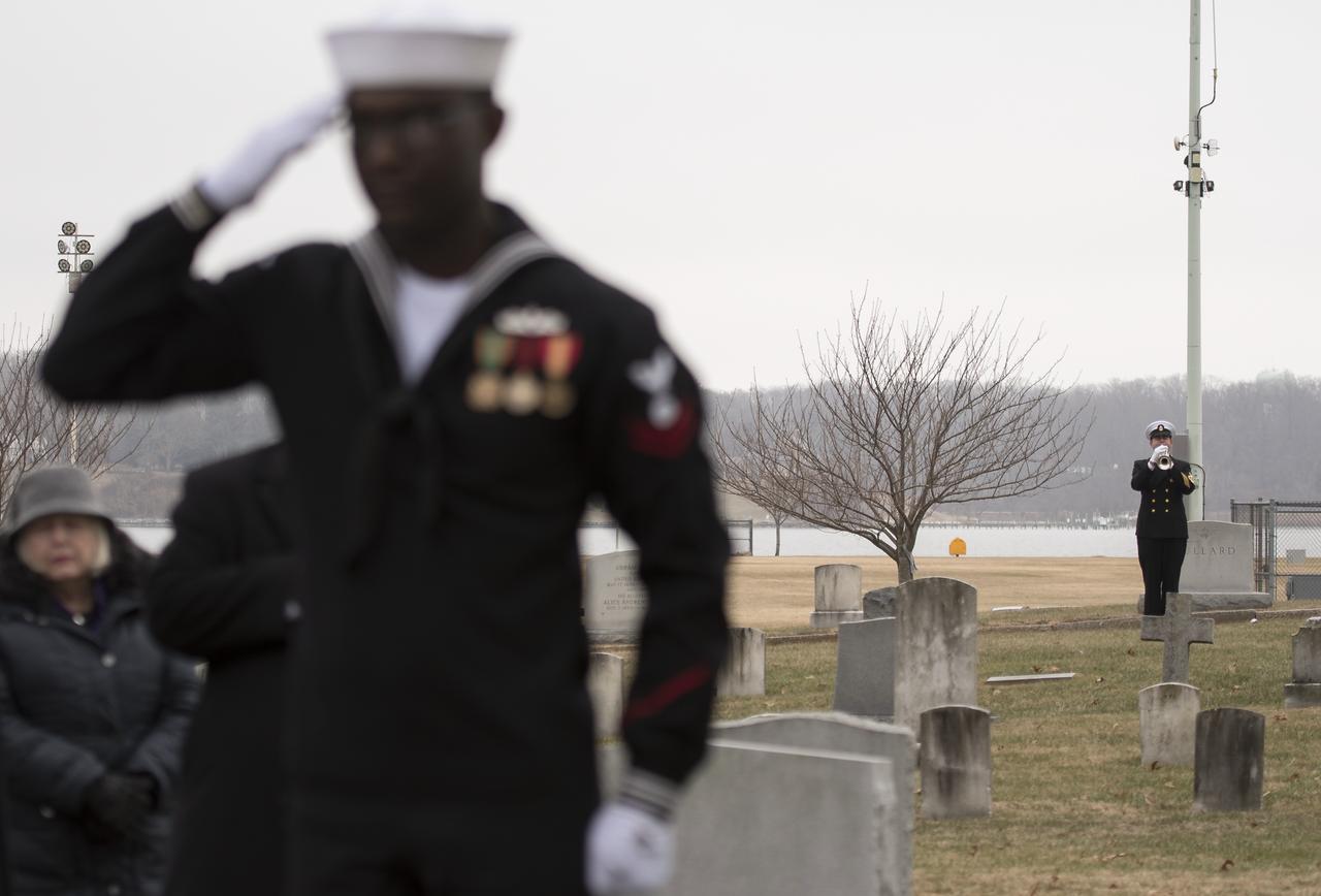 Taps is played during the interment service for former NASA astronaut Captain Bruce McCandless II, USN (Ret.), Tuesday, Jan. 16, 2018 at the United States Naval Academy Cemetery in Annapolis, Maryland. Photo Credit: (NASA/Bill Ingalls)