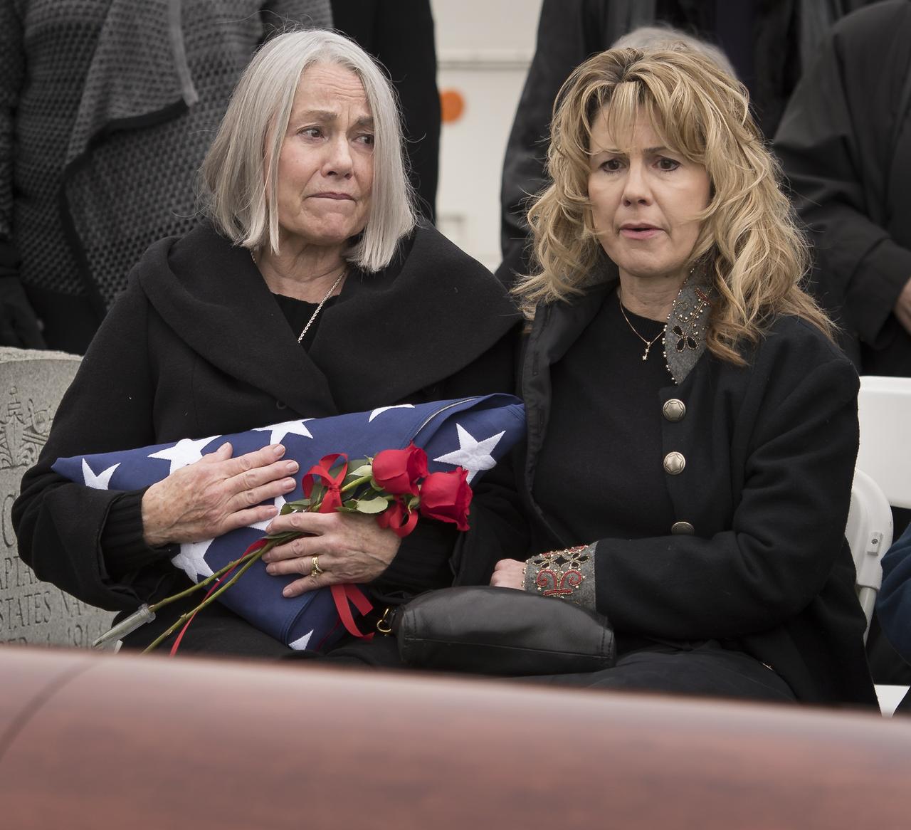 Ellen Shields McCandless, wife of former NASA astronaut Captain Bruce McCandless II, USN (Ret.), left, is seen during her husband's interment service, Tuesday, Jan. 16, 2018 at the United States Naval Academy Cemetery in Annapolis, Maryland. Photo Credit: (NASA/Bill Ingalls)