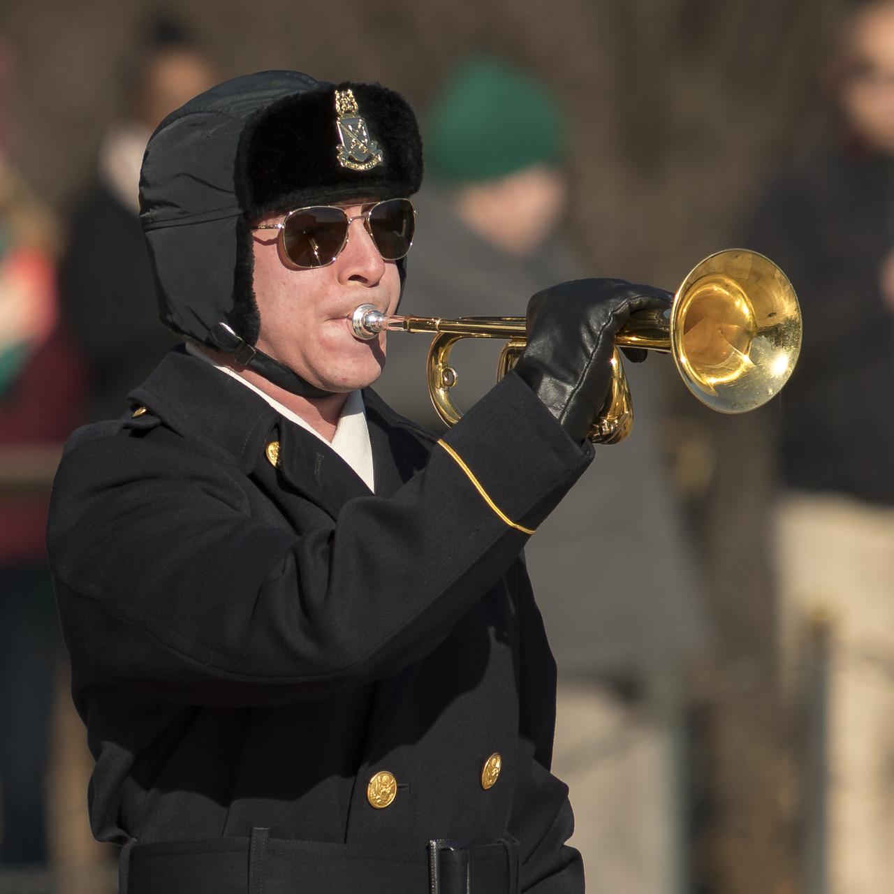 Taps is played by a member of The Old Guard after acting NASA Administrator Robert Lightfoot, Amy Resnik, sister-in-law, and Chuck Resnik, brother of the late space shuttle Challenger astronaut Judy Resnik laid a wreath at the Tomb of the Unknowns as part of NASA's Day of Remembrance, Thursday, Jan. 25, 2018, at Arlington National Cemetery in Arlington, Virginia. Wreaths were laid in memory of those men and women who lost their lives in the quest for space exploration. Photo Credit: (NASA/Bill Ingalls)