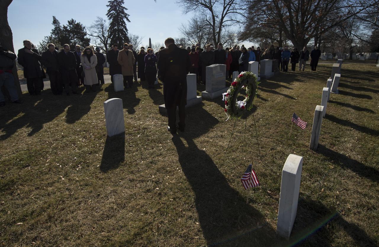Acting NASA Administrator Robert Lightfoot, NASA employees, and members of the public bow their heads at the graves of Apollo 1 crew members, Virgil Grissom and Roger Chaffee during a wreath laying ceremony as part of NASA's Day of Remembrance, Thursday, Jan. 25, 2018, at Arlington National Cemetery in Arlington, Virginia. Wreaths were laid in memory of those men and women who lost their lives in the quest for space exploration. Photo Credit: (NASA/Bill Ingalls)