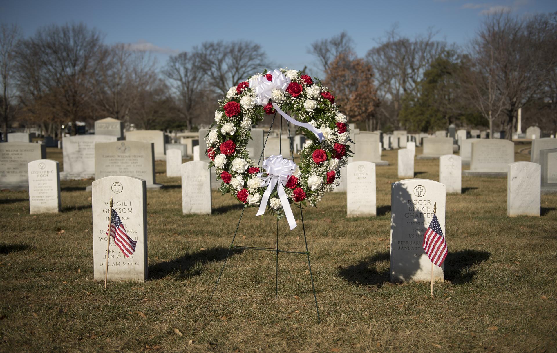 The graves of Apollo 1 crew members, Virgil Grissom, left, and Roger Chaffee are seen during a wreath laying ceremony as part of NASA's Day of Remembrance, Thursday, Jan. 25, 2018, at Arlington National Cemetery in Arlington, Virginia. Wreaths were laid in memory of those men and women who lost their lives in the quest for space exploration.