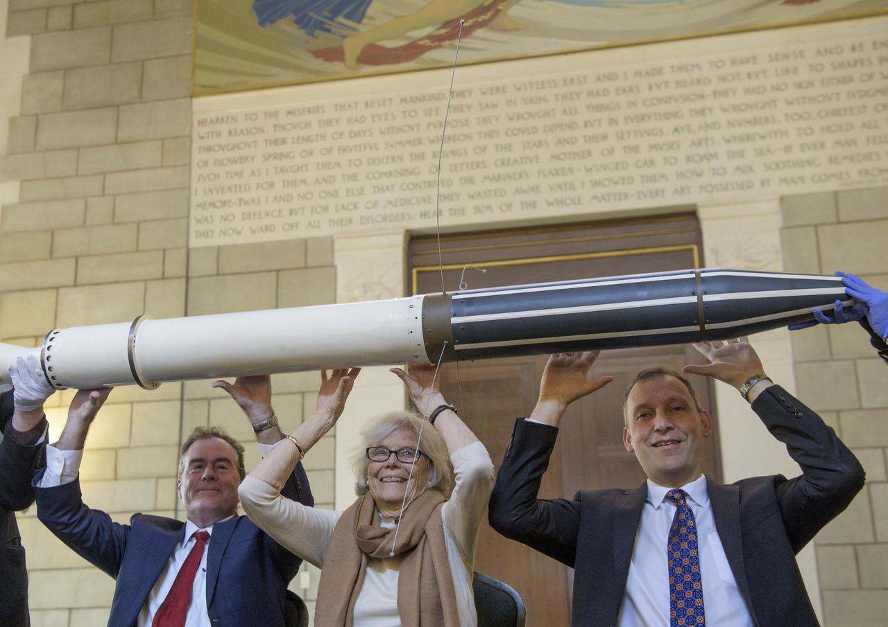 Michael Watkins, Director of NASA's Jet Propulsion Laboratory, left, Susan Finley, who began working at NASA's Jet Propulsion Laboratory in January 1958 as a "human computer", center, and Thomas Zurbuchen, Associate Administrator for NASA's Science Mission Directorate, right, reenact the famous picture of Dr. William H. Pickering, Dr. James A. van Allen, and Dr. Wernher von Braun, hoisting a model of Explorer 1 above their heads at a press conference announcing the satellite's success with a replica of the Explorer 1 satellite during an event celebrating the 60th Anniversary of the Explorer 1 mission and the discovery of Earth's radiation belts, Wednesday, Jan. 31, 2018, at the National Academy of Sciences in Washington. The first U.S. satellite, Explorer 1, was launched from Cape Canaveral on January 31, 1958. The 30-pound satellite would yield a major scientific discovery, the Van Allen radiation belts circling our planet, and begin six decades of groundbreaking space science and human exploration. (NASA/Joel Kowsky)